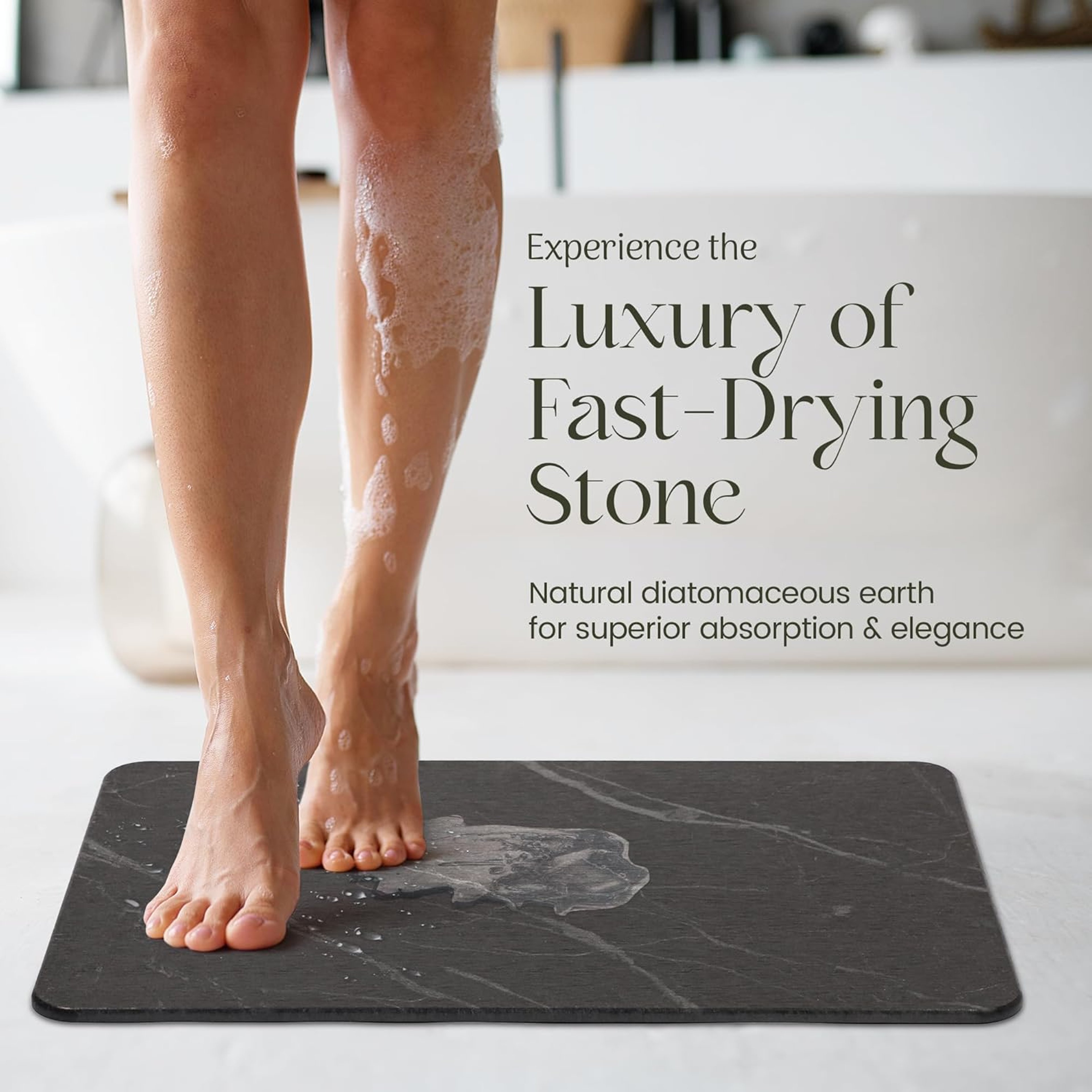 Wet feet stepping from a bath onto the Solvio fast-drying stone bath mat in a bright bathroom