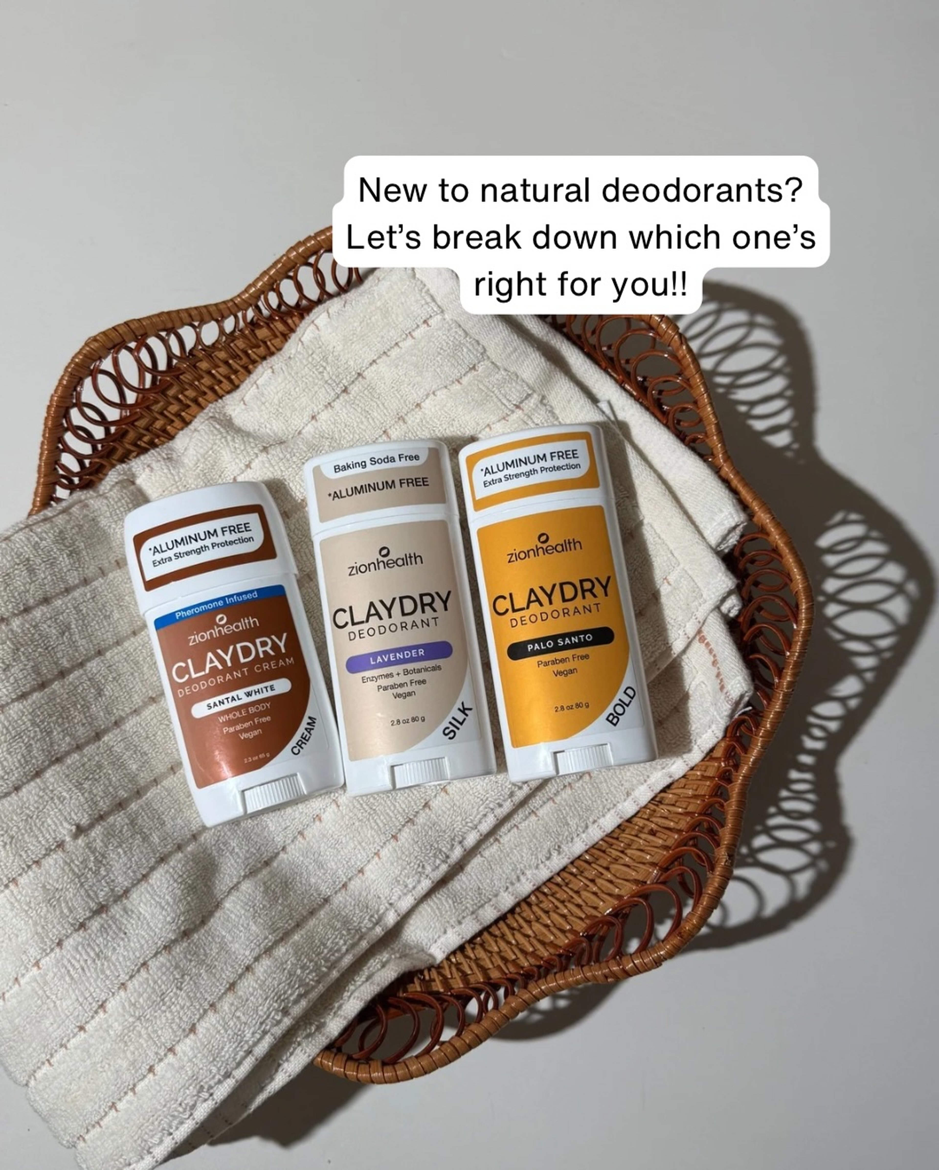 Zion Health ClayDry deodorant trio — Santal White, Lavender, and Palo Santo sticks on a woven tray