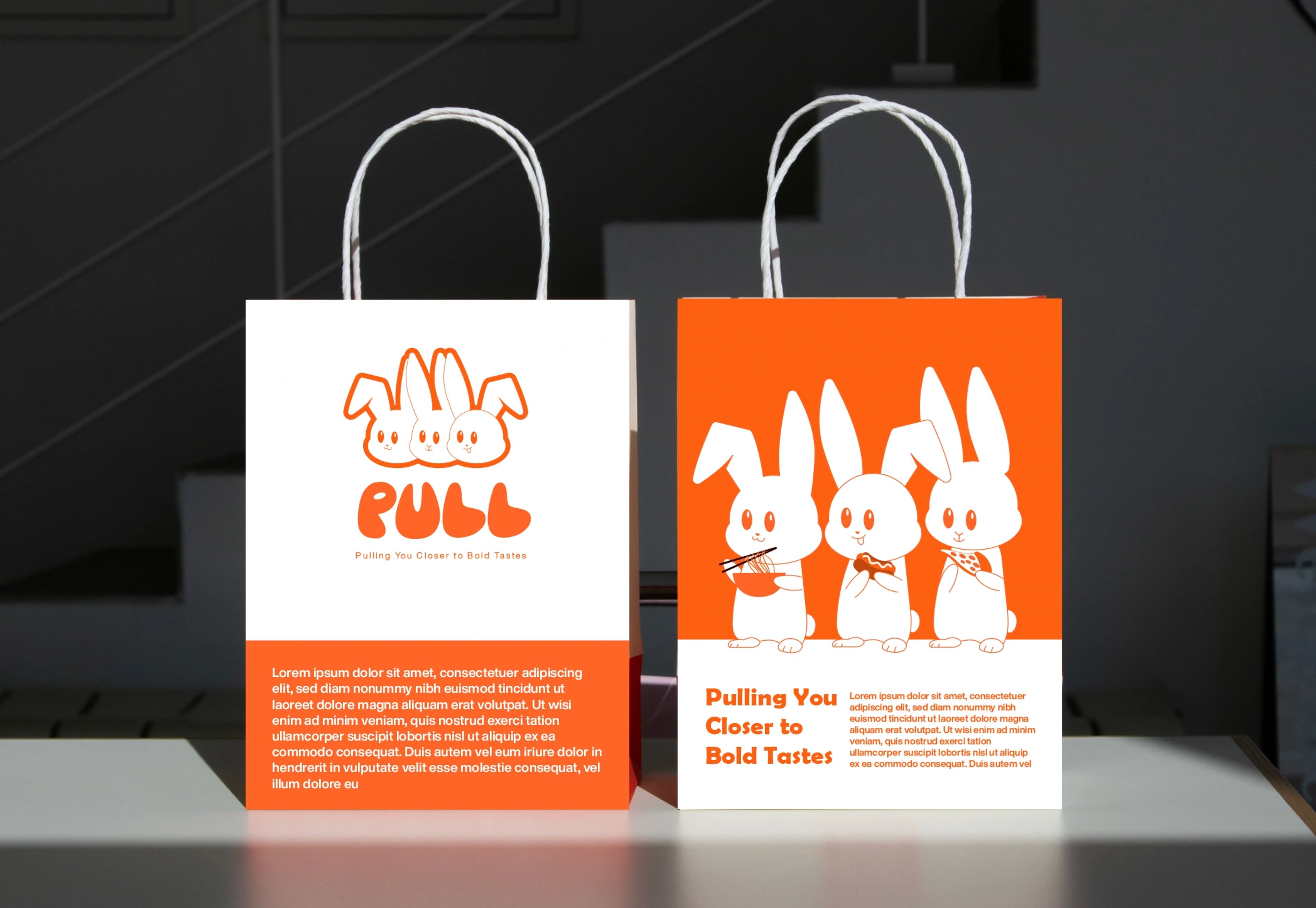 Two PULL kraft shopping bags, one white and one orange, printed with the bunnies and 'Pulling You Closer to Bold Tastes'