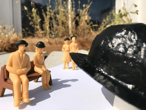 Plastic figures in bowler hats