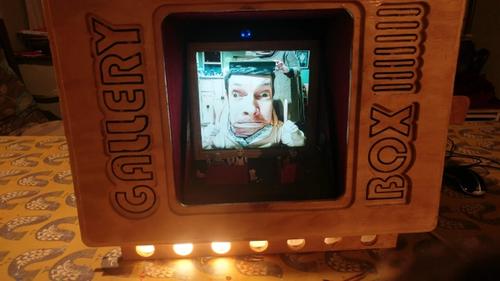 distorted man's head on screen in box