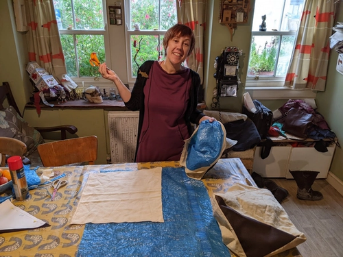 Woman sewing felt and tarp bags