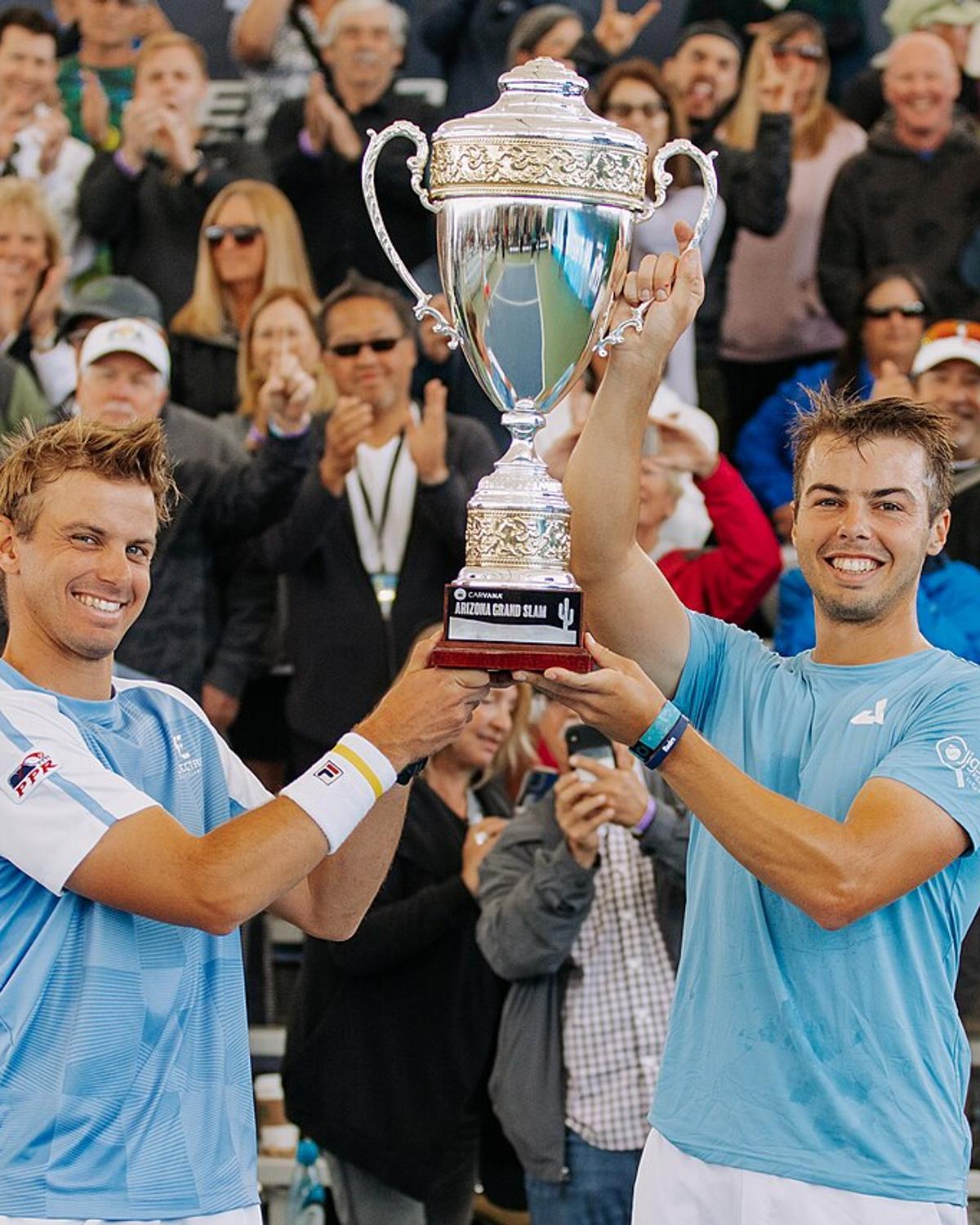 Ben Johns (right) and his brother Collin Johns holding the men's doubles trophy at the PPA Arizona Grand Slam in February 2023