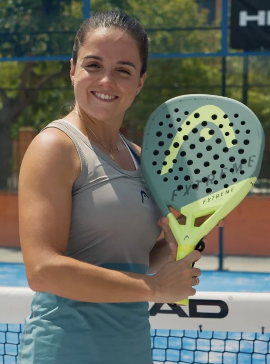 Paula Josemaría holding a padel racket on court