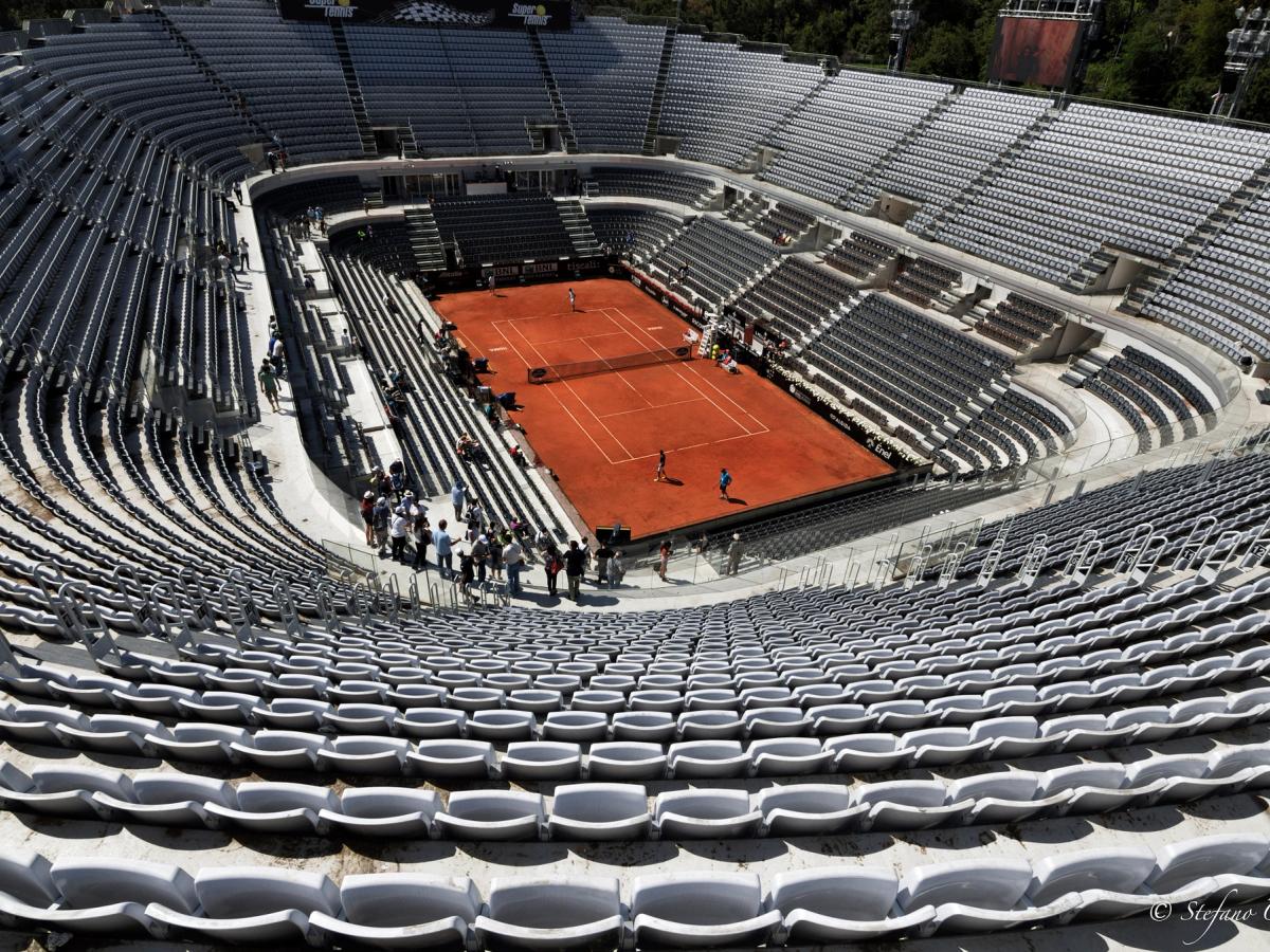 The clay centre court at the Foro Italico seen from high in its largely empty stands