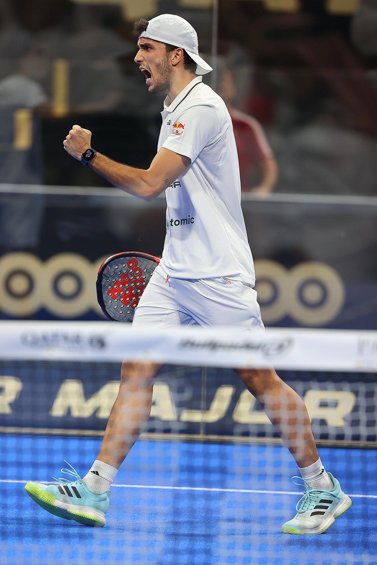 Alejandro Galán celebrating a point during a padel match