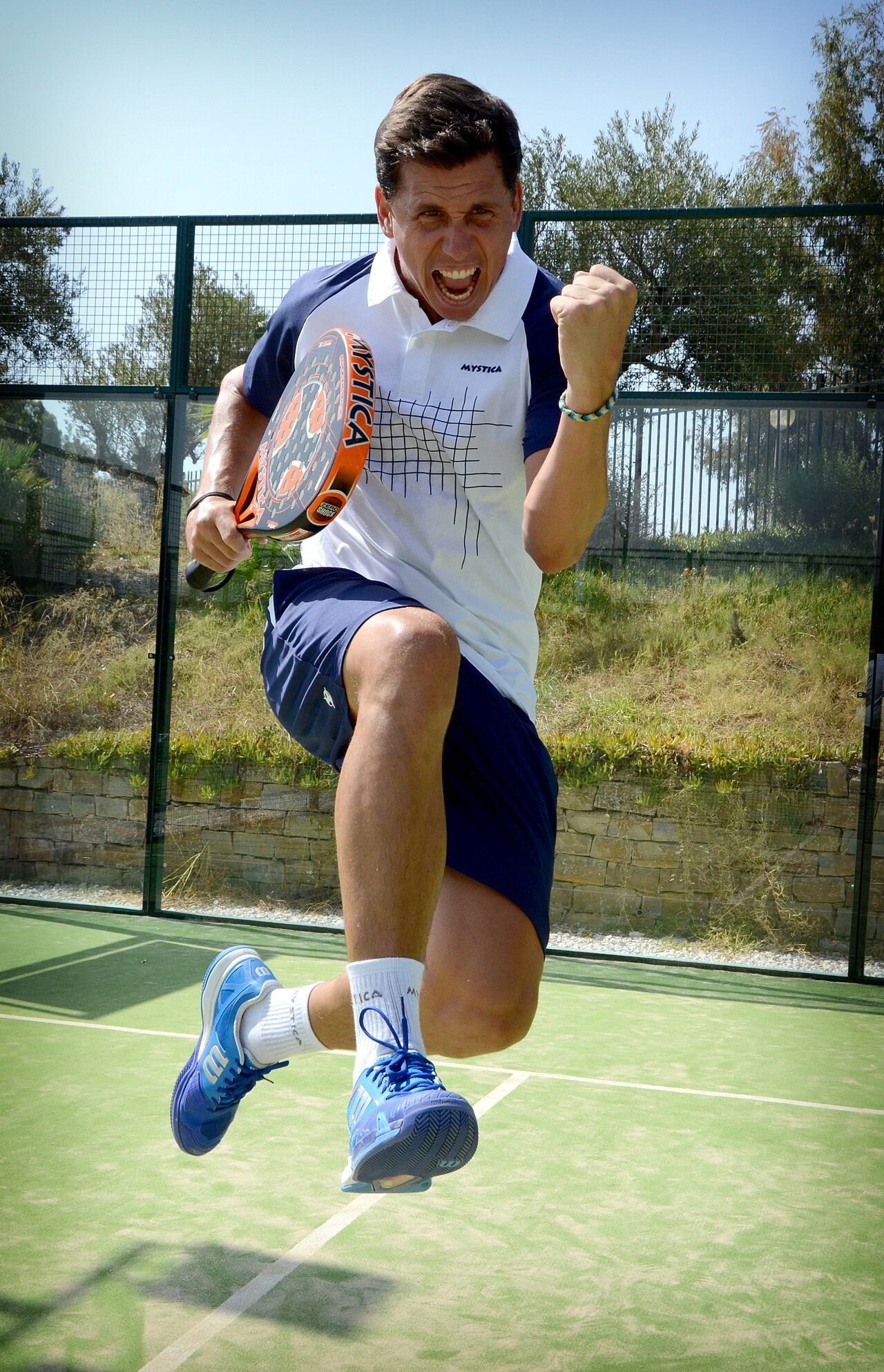 Francisco 'Paquito' Navarro jumping in celebration on a padel court