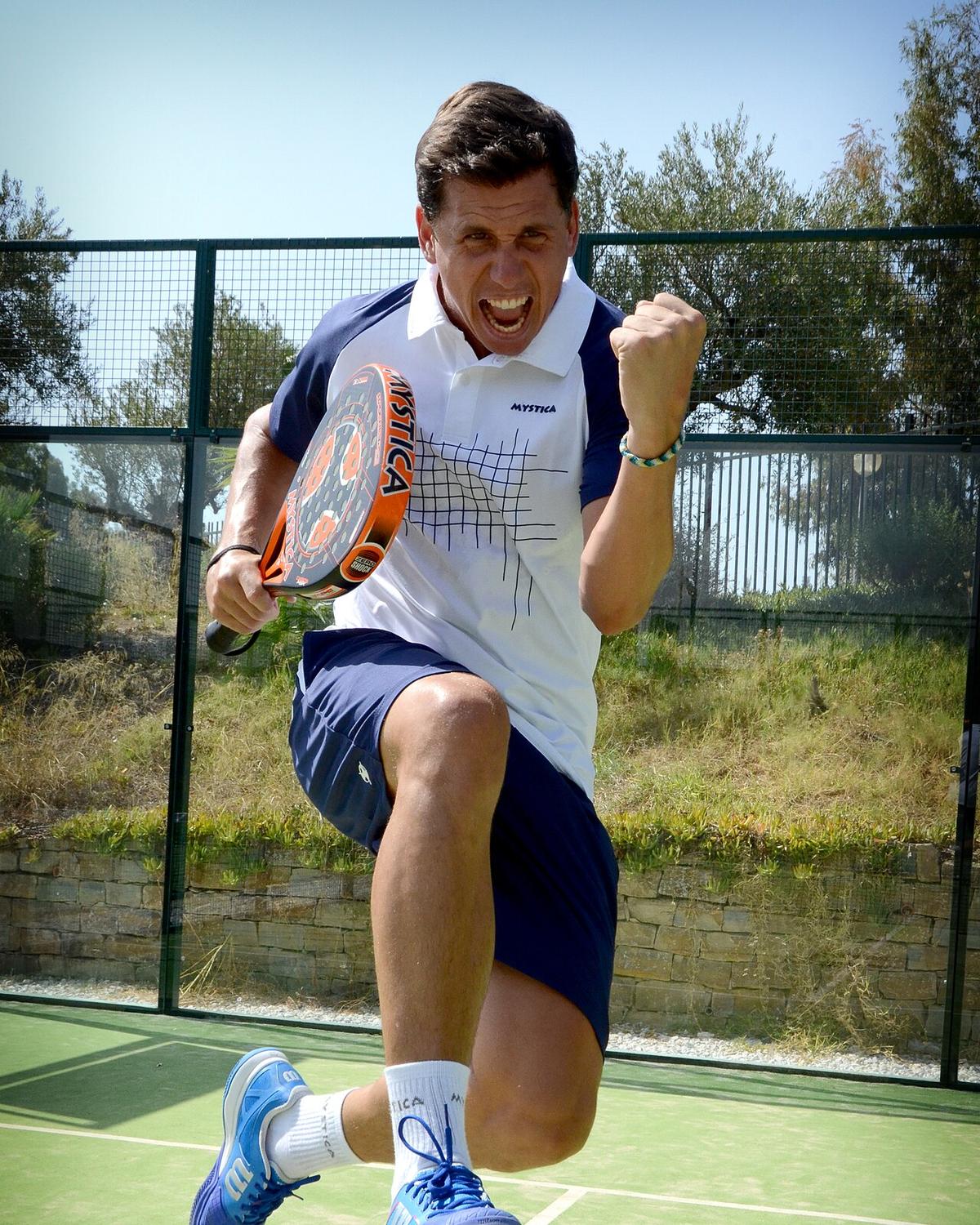 Francisco 'Paquito' Navarro jumping in celebration on a padel court