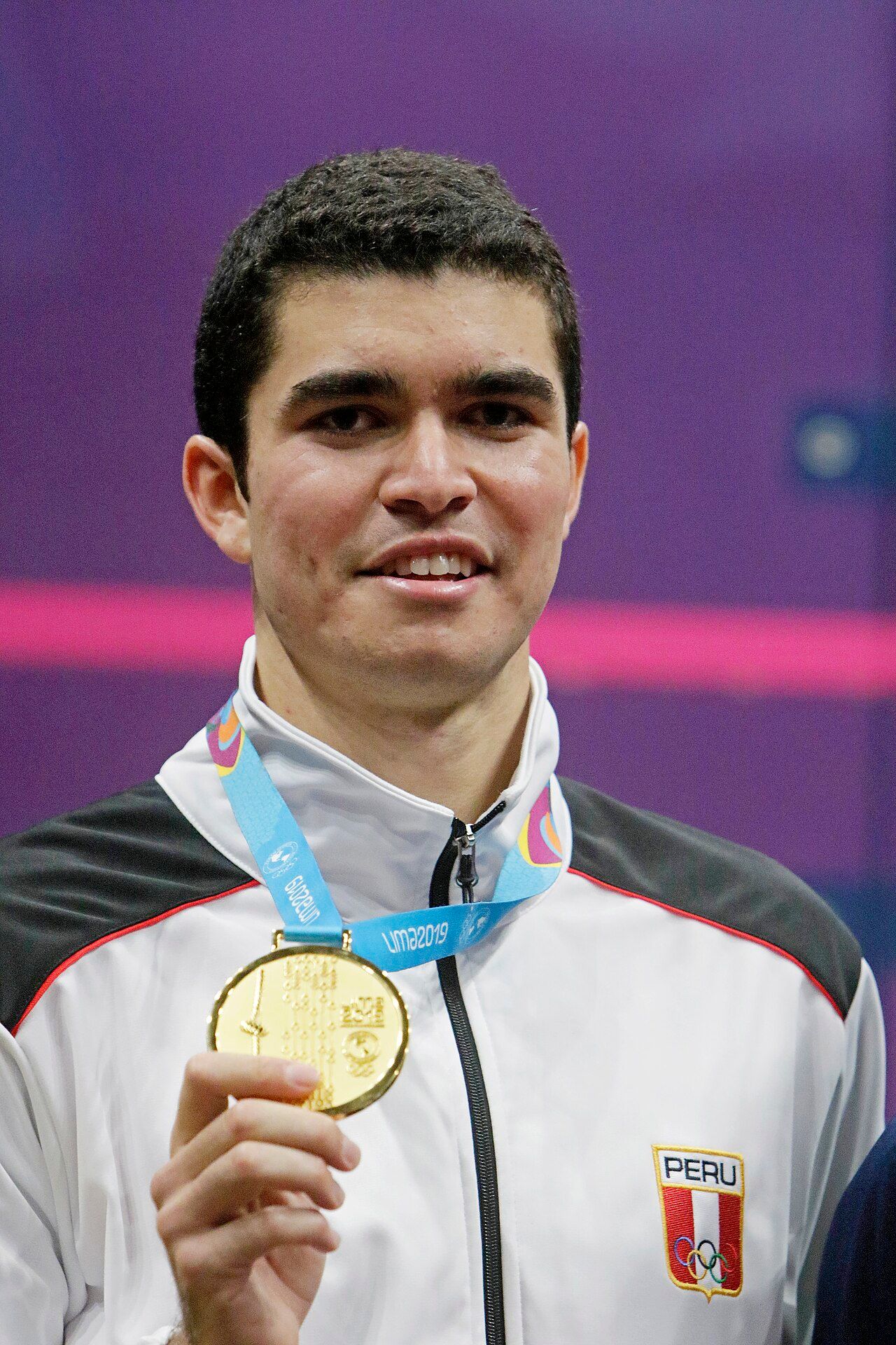 Diego Elias holding a gold medal at the Lima 2019 Pan American Games