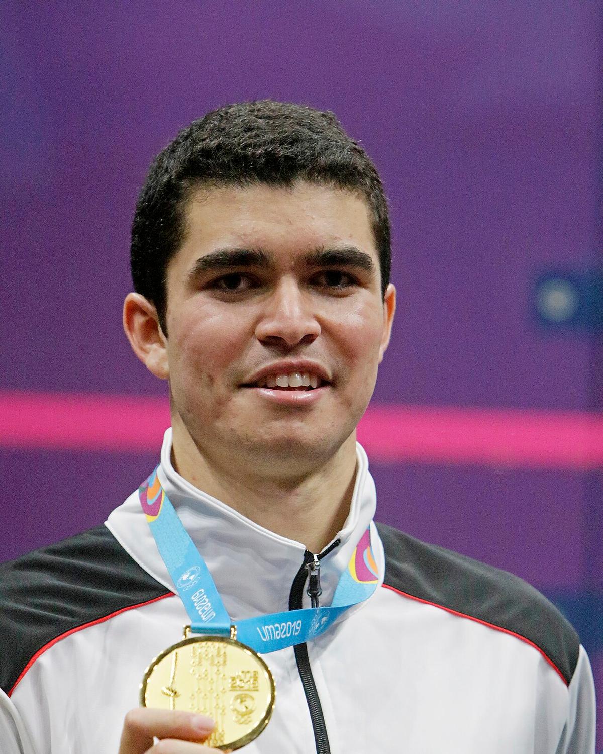 Diego Elias holding a gold medal at the Lima 2019 Pan American Games