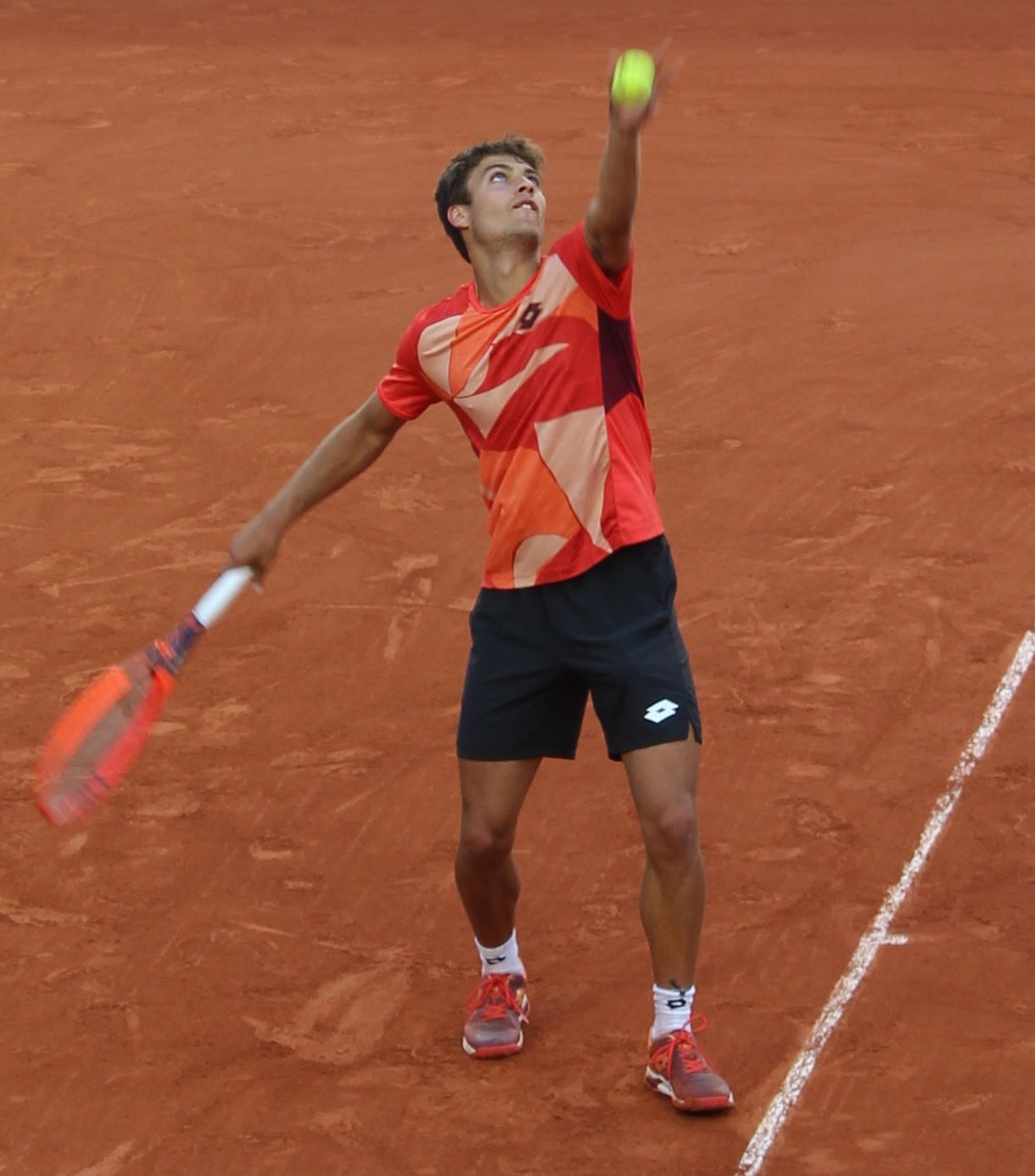Flavio Cobolli serving at Roland-Garros, 2023