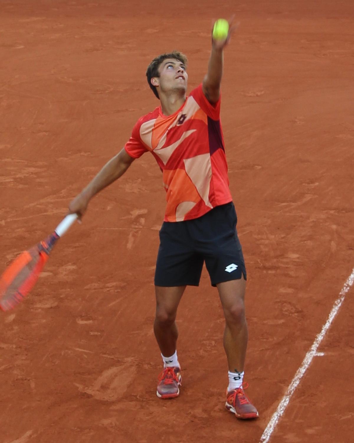Flavio Cobolli serving at Roland-Garros, 2023