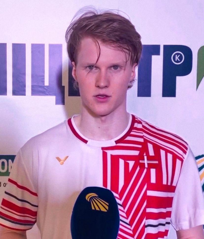 Anders Antonsen in a Denmark shirt giving a post-match interview
