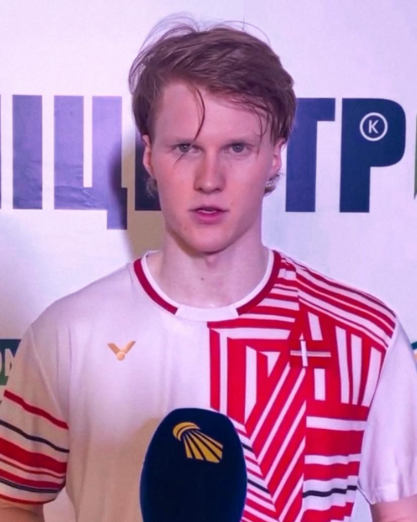 Anders Antonsen in a Denmark shirt giving a post-match interview