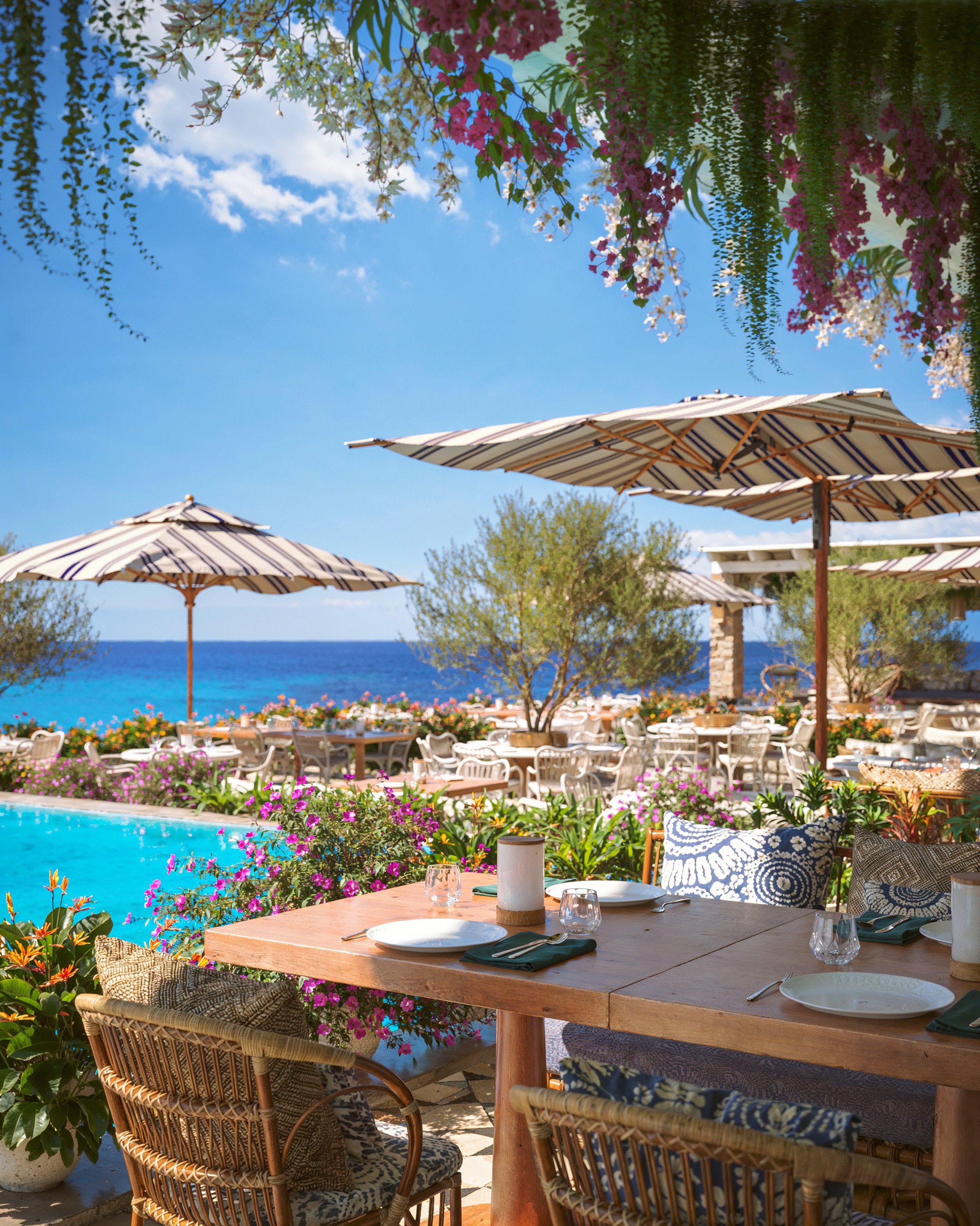 Parasols and loungers above the bay at Santa Marina Hotel