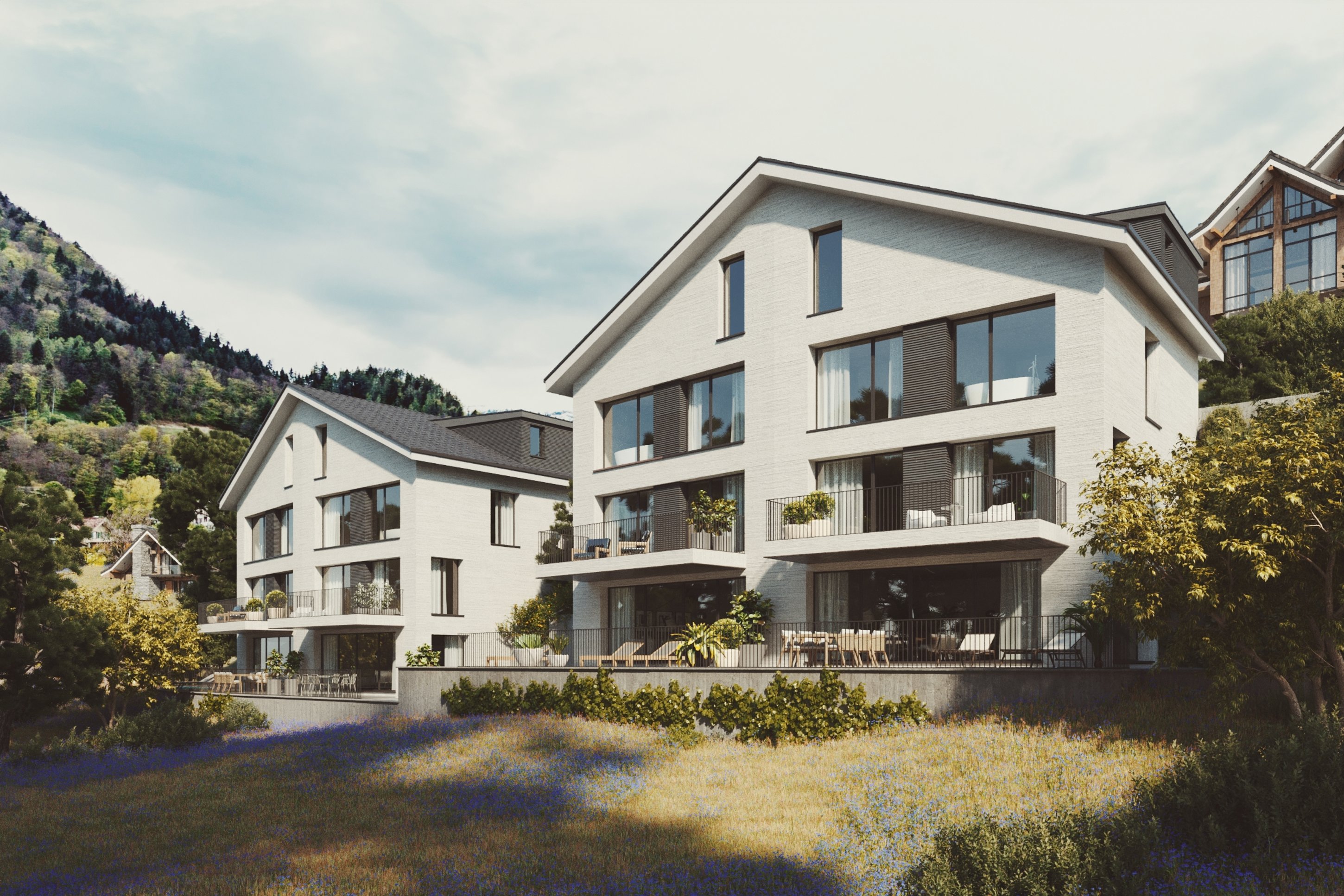 Gersau House apartment building with balconies above a landscaped slope