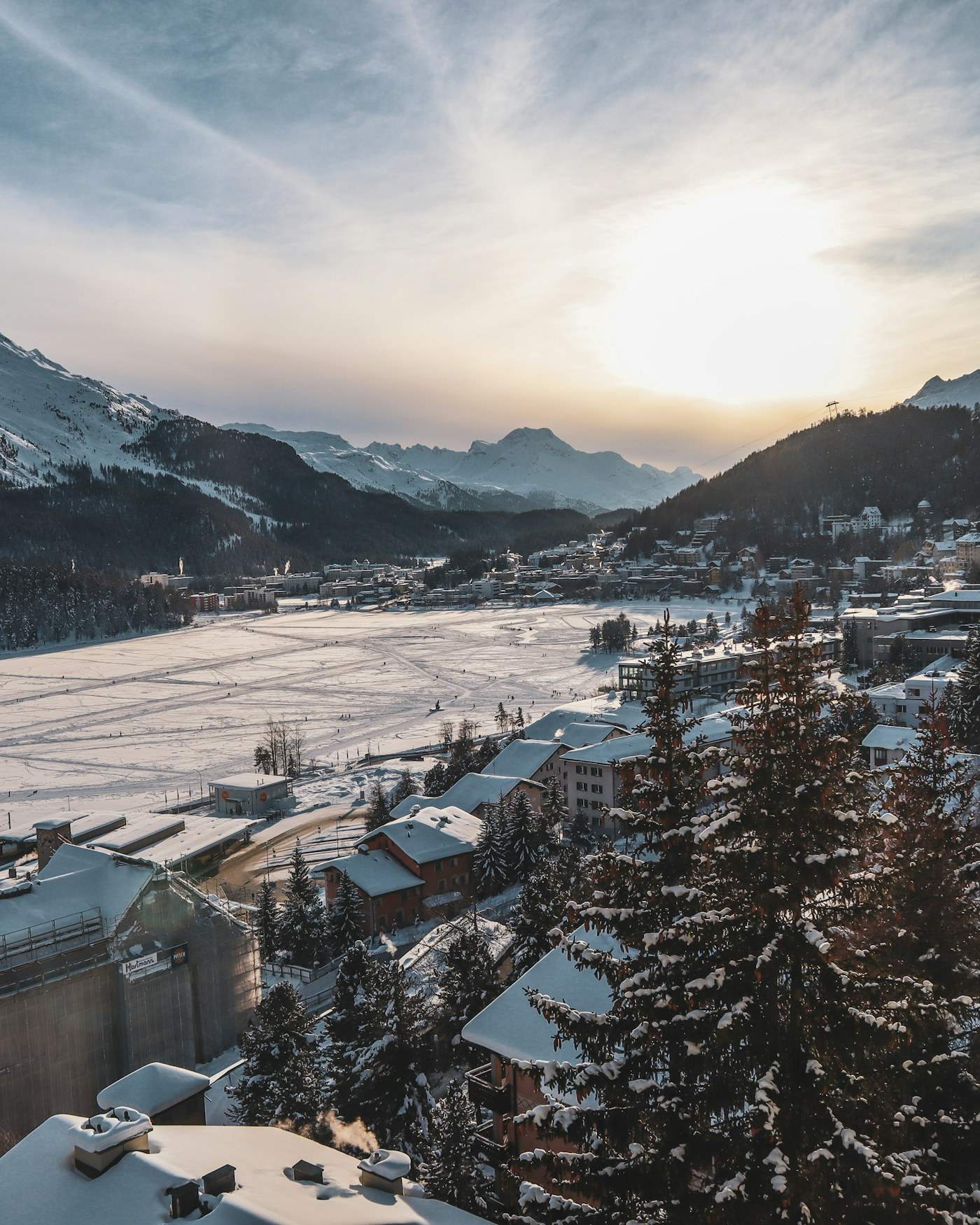 Snow-covered alpine mountains with trees in the foreground