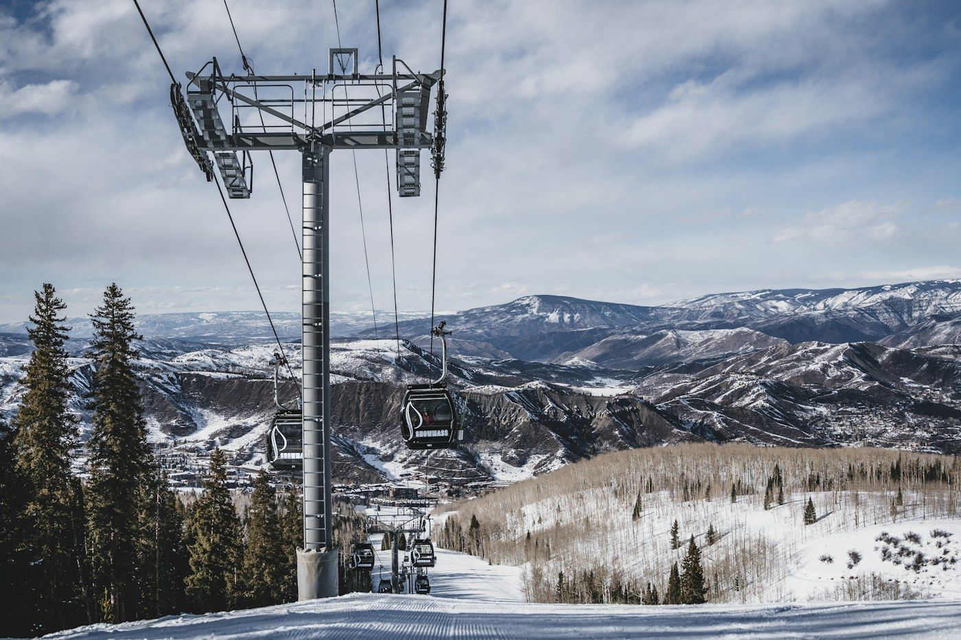 Cable cars over a snow-covered mountain