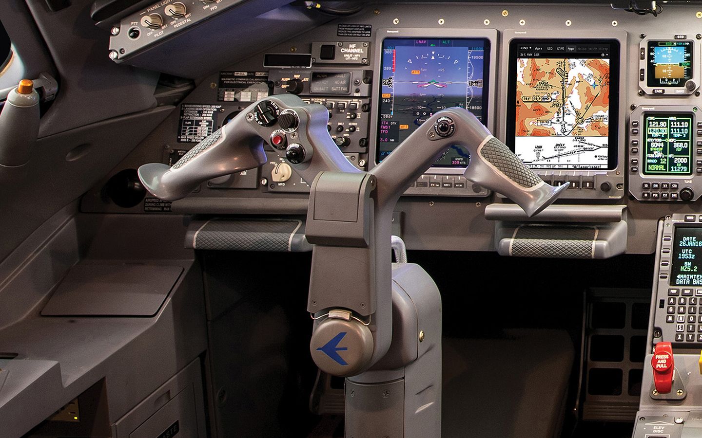 Legacy 650 cockpit detail showing the captain’s control yoke, flight displays and instrument panel.