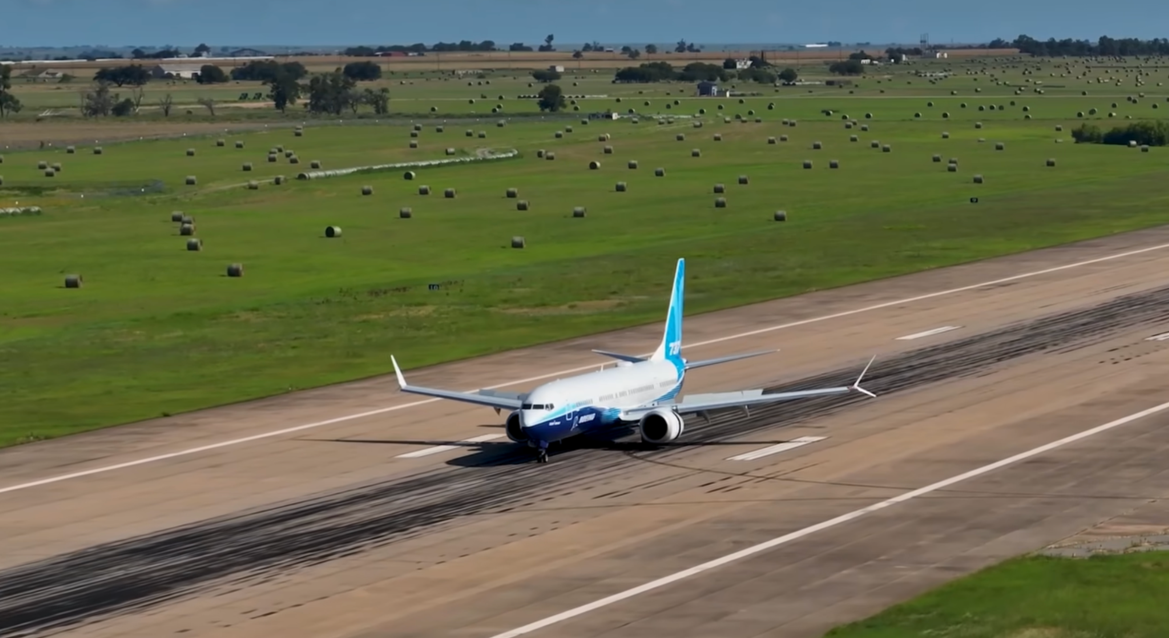 Boeing 737-10 viewed from the front on an airfield runway