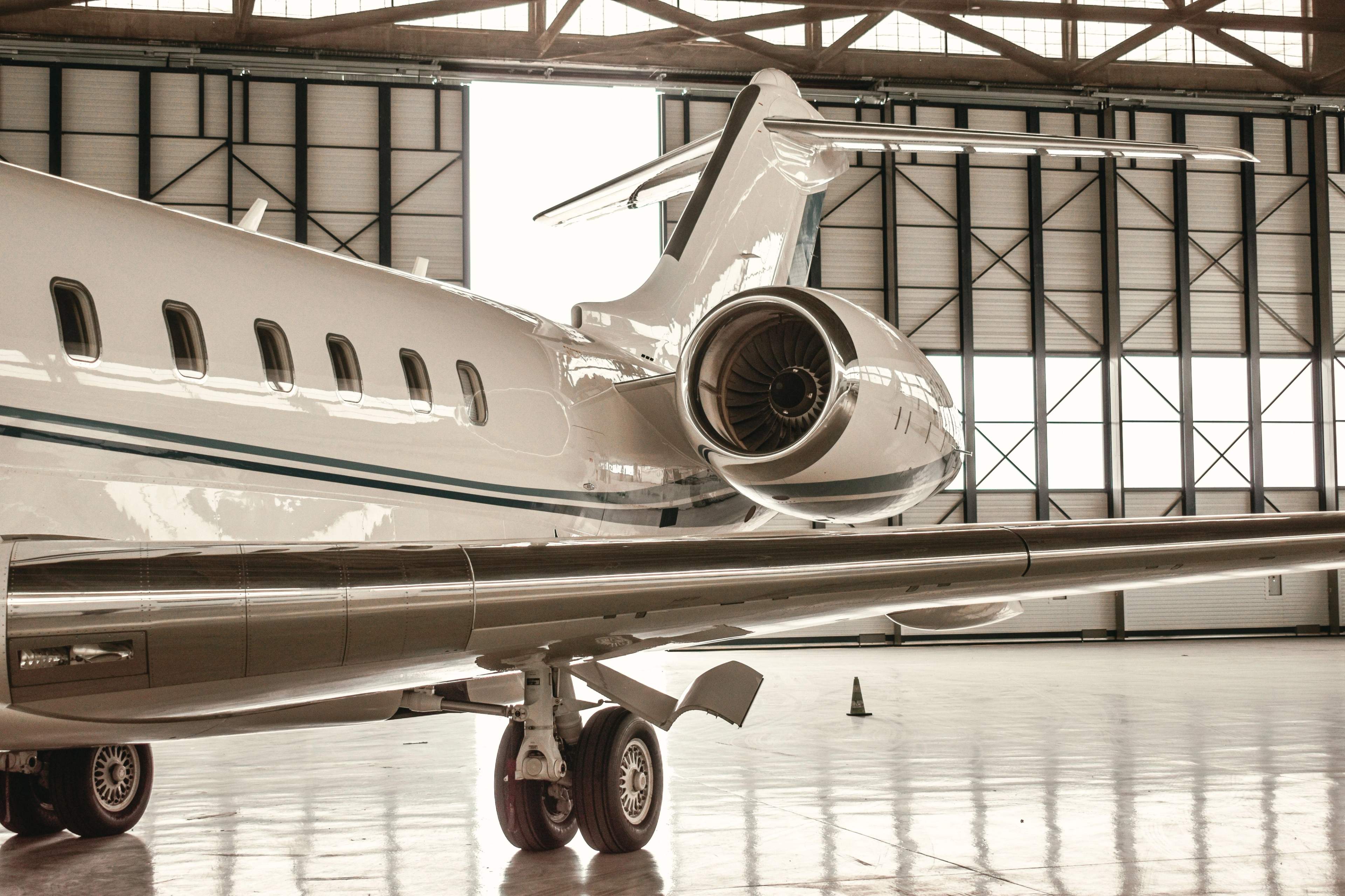 Private jet parked inside a hangar