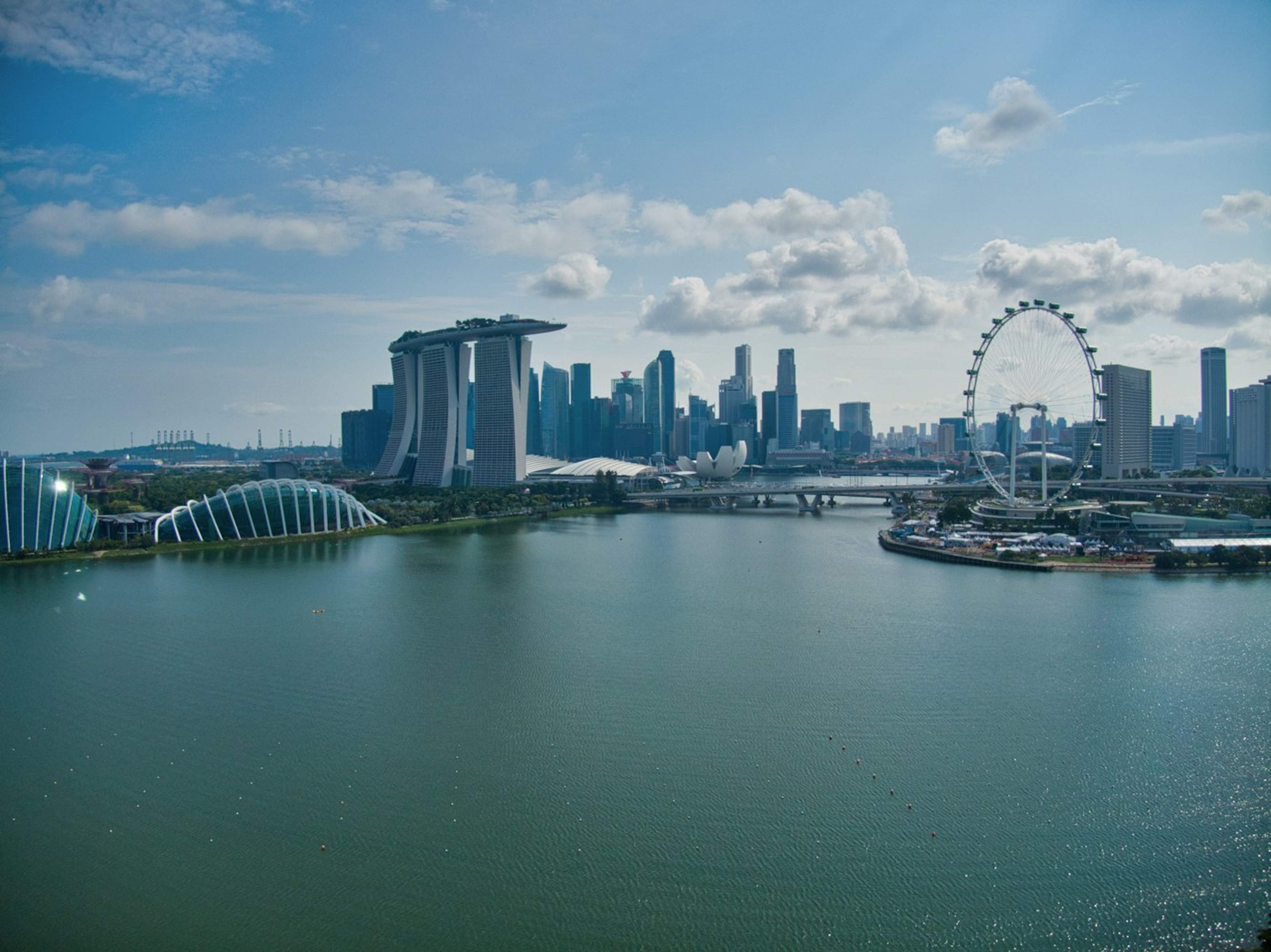 Singapore waterfront with boats and city buildings