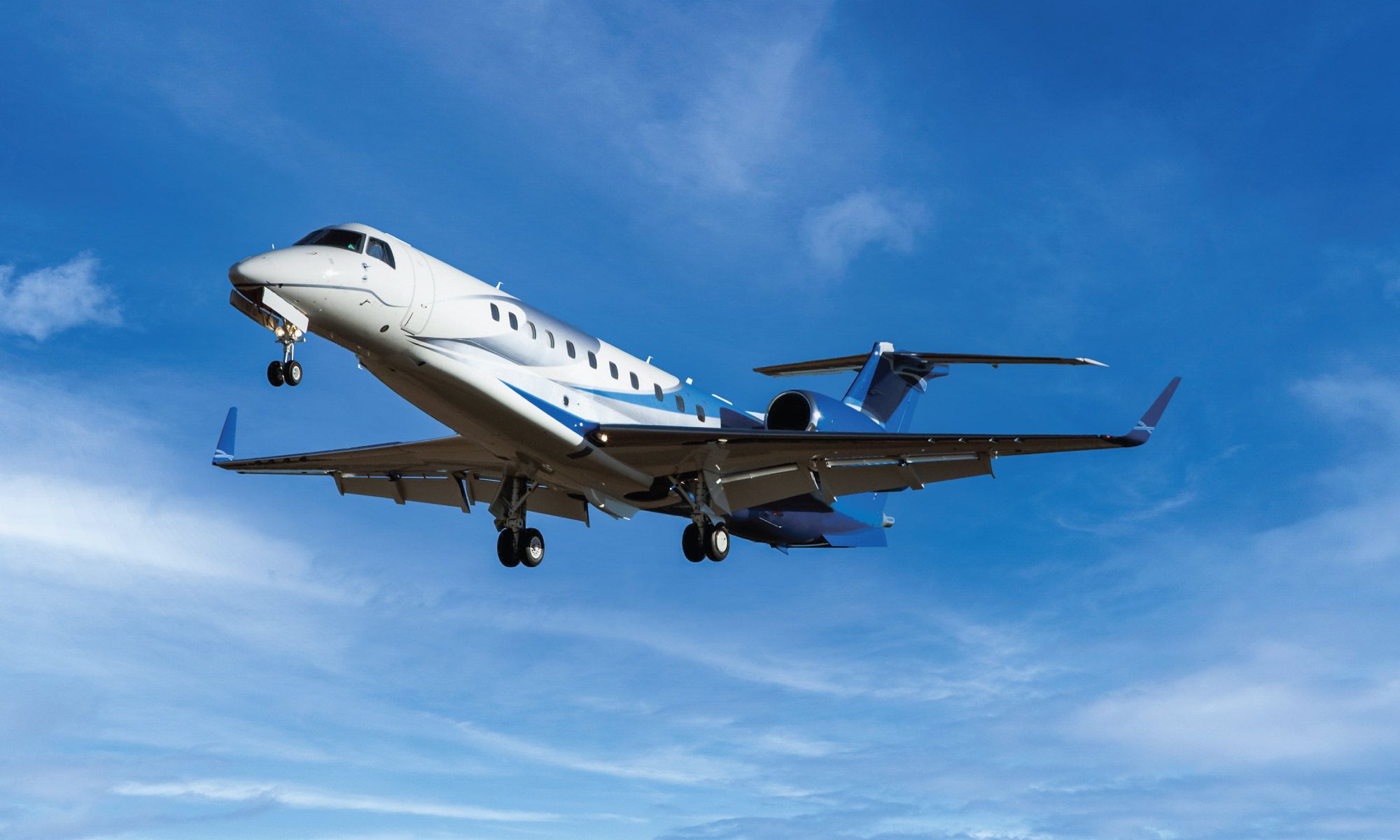 G-KGKG, Luxaviation UK’s Embraer Legacy 600, photographed on approach with its landing gear extended.