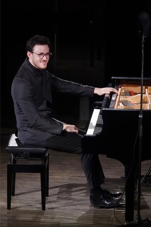 Aris Alexander Blettenberg sitting at the grand piano at the Samos Young artists Festival 2023