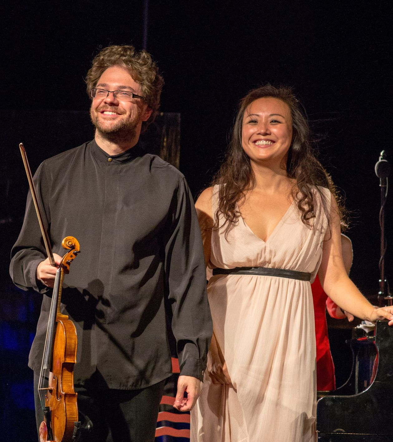 Alexander Sitkovetski and his wife Wu Qian smiling on stage of the Samos Young Artists Festival after their concert