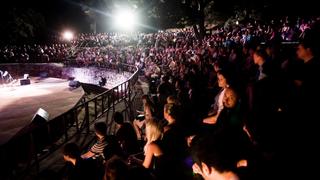 The ancient theatre of Pythagorion at night filled with people