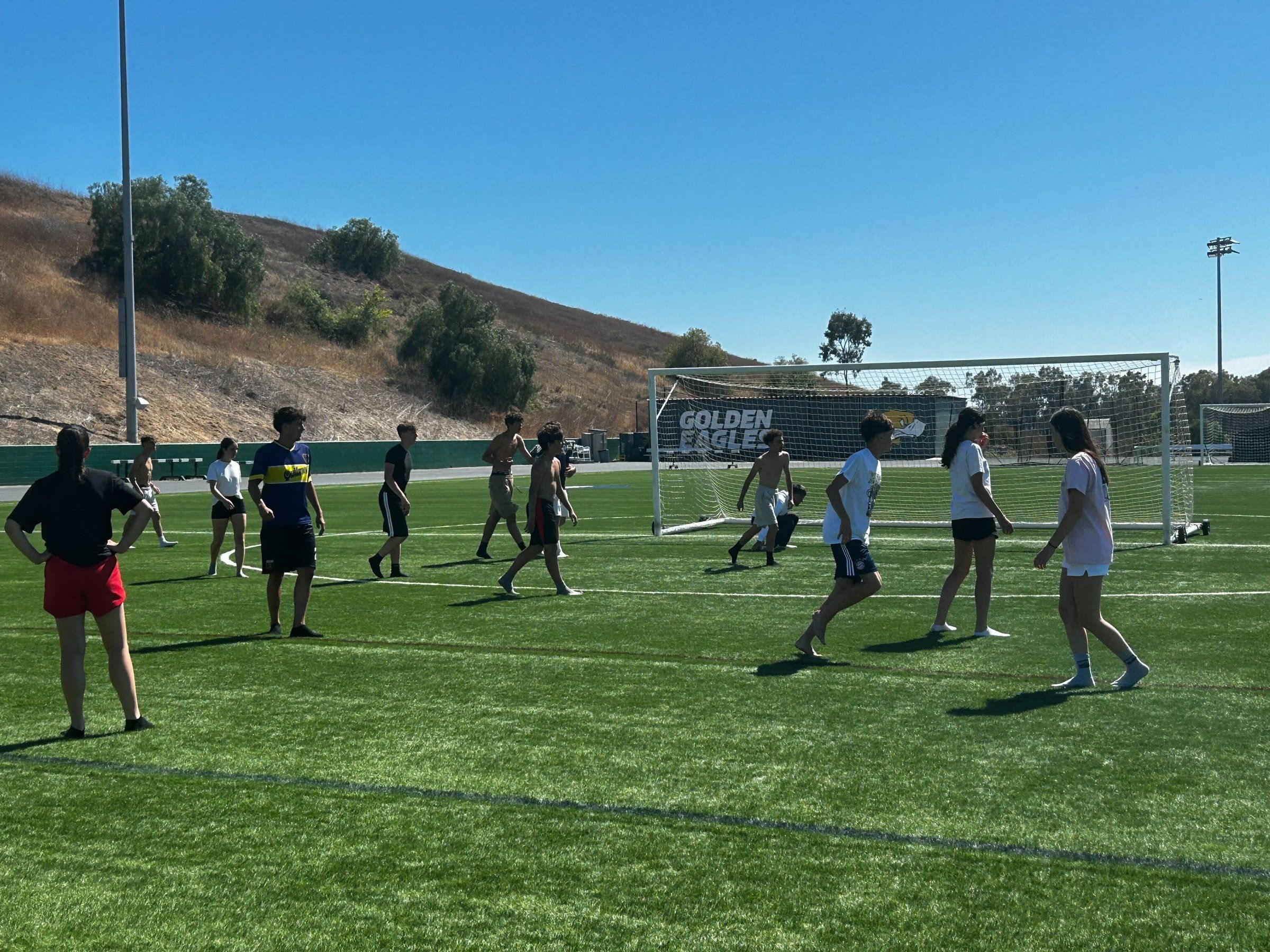 Students playing soccer on the Concordia campus field
