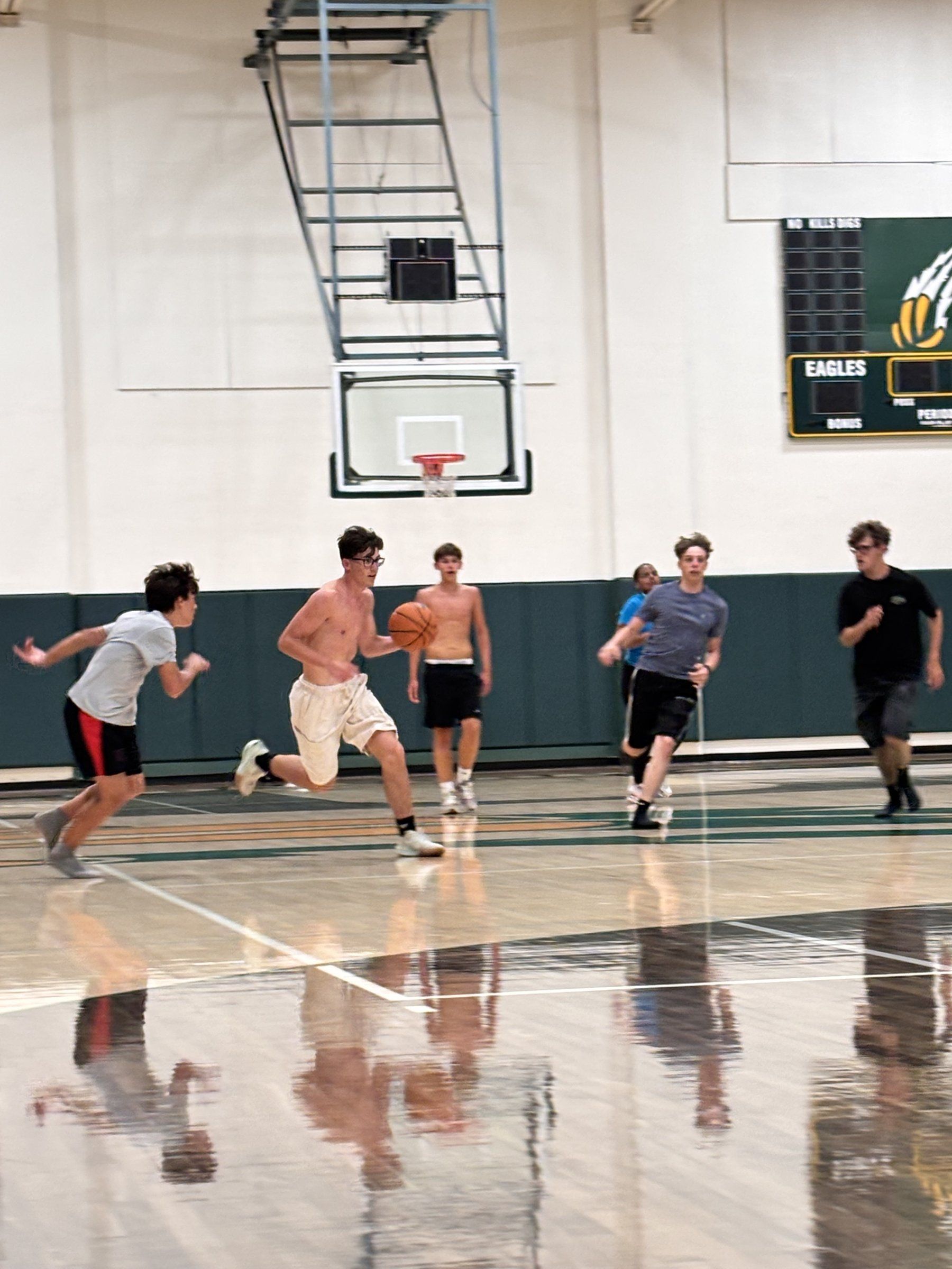 Students playing basketball in the Concordia gym