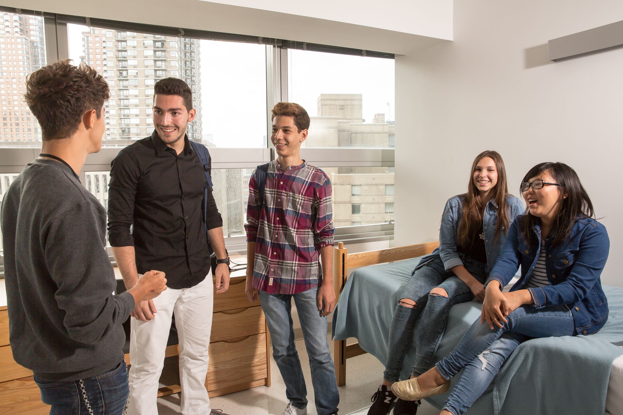 Students socializing in a Fordham University at Lincoln Center residence room