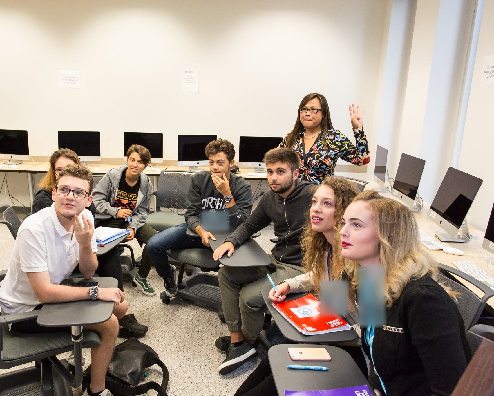 YES USA students joining in during a class with their teacher at Fordham