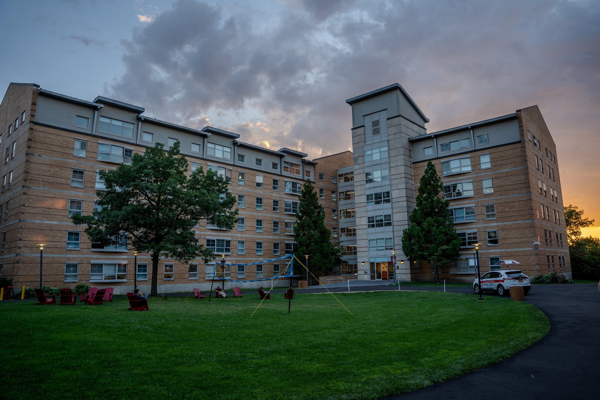 St. John's residence halls around a lawn at dusk