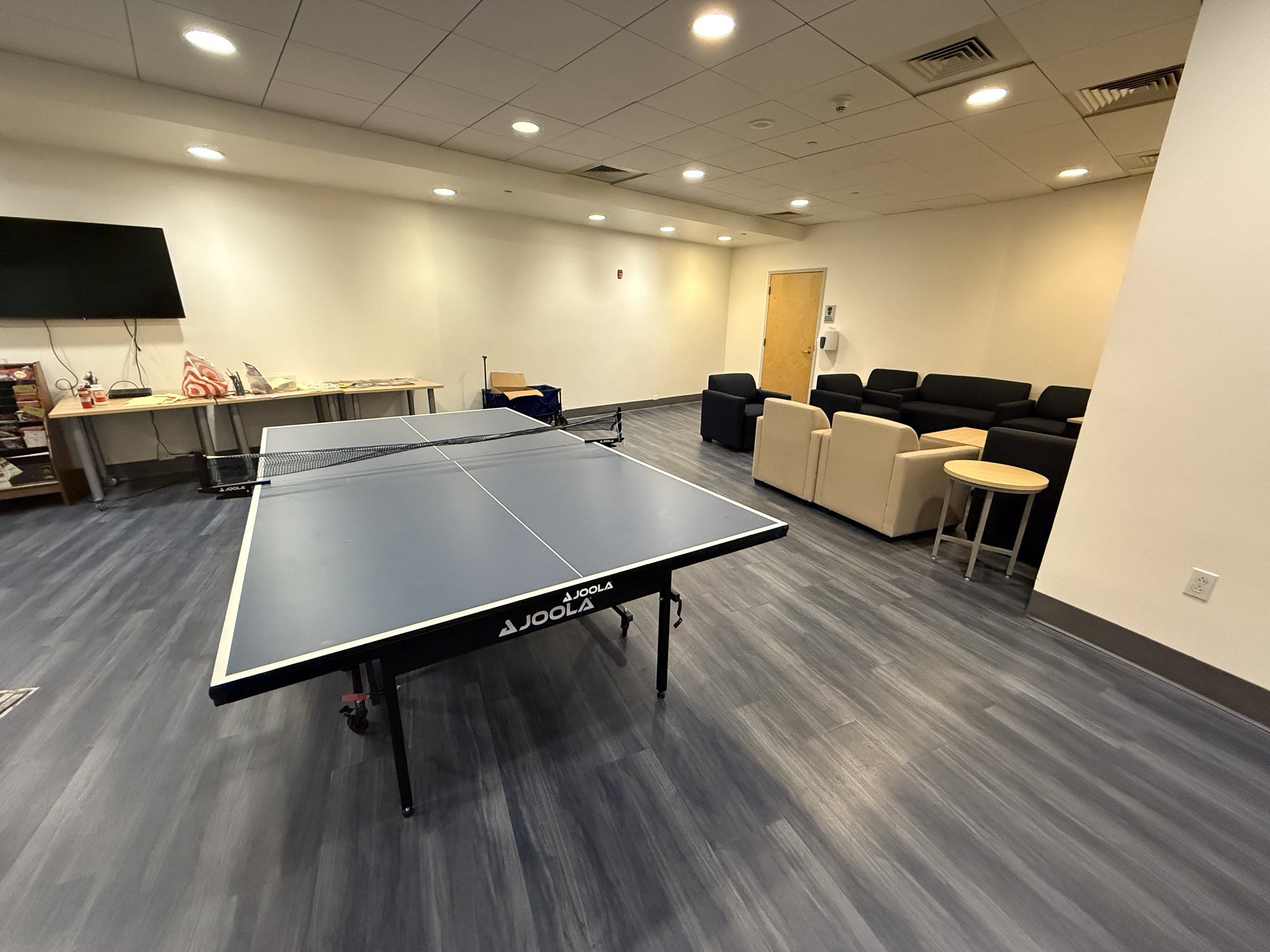 Residence games room with a table tennis table and sofas
