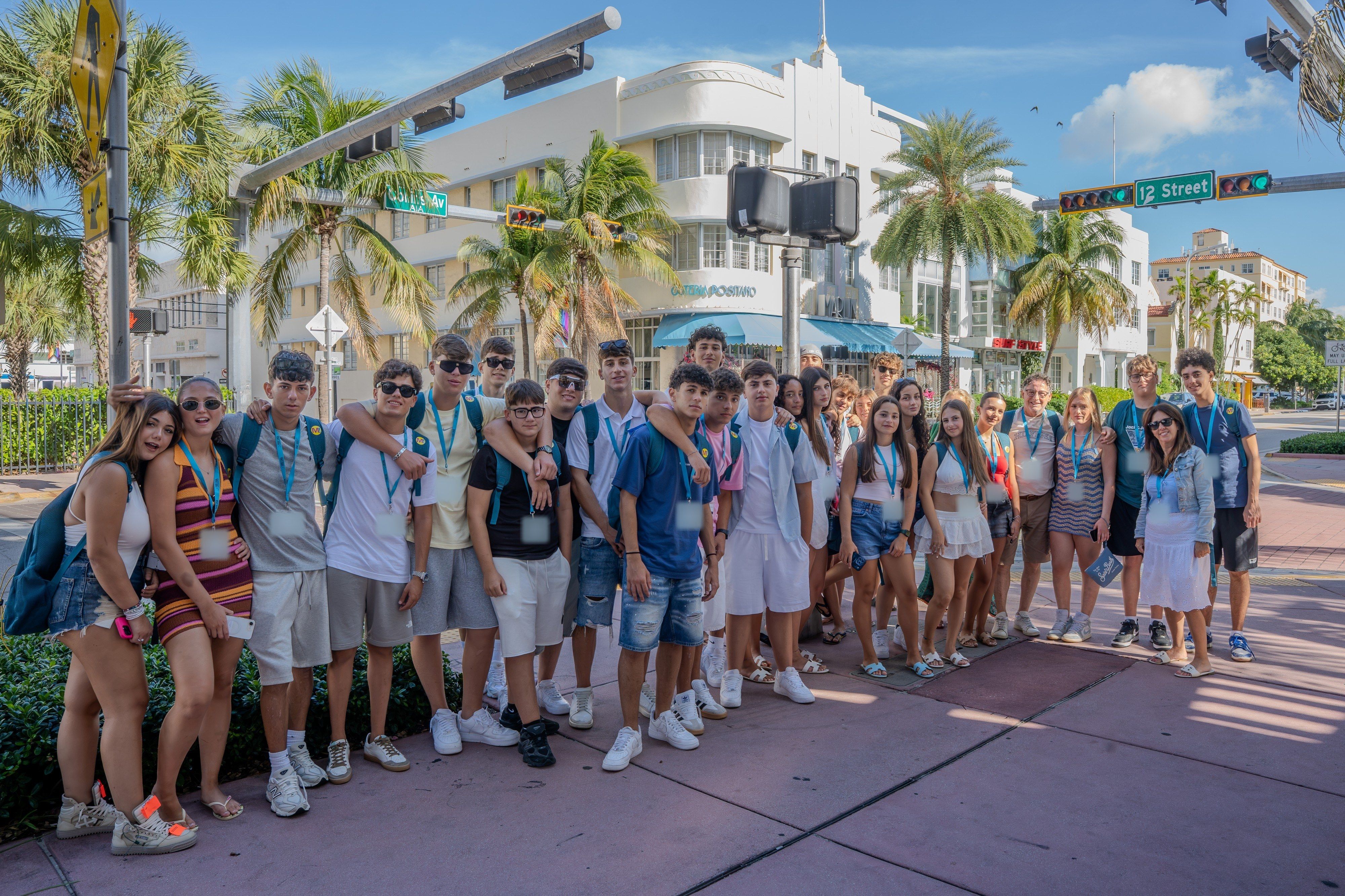 A YES USA group on Ocean Drive, Miami Beach, in front of an Art Deco hotel