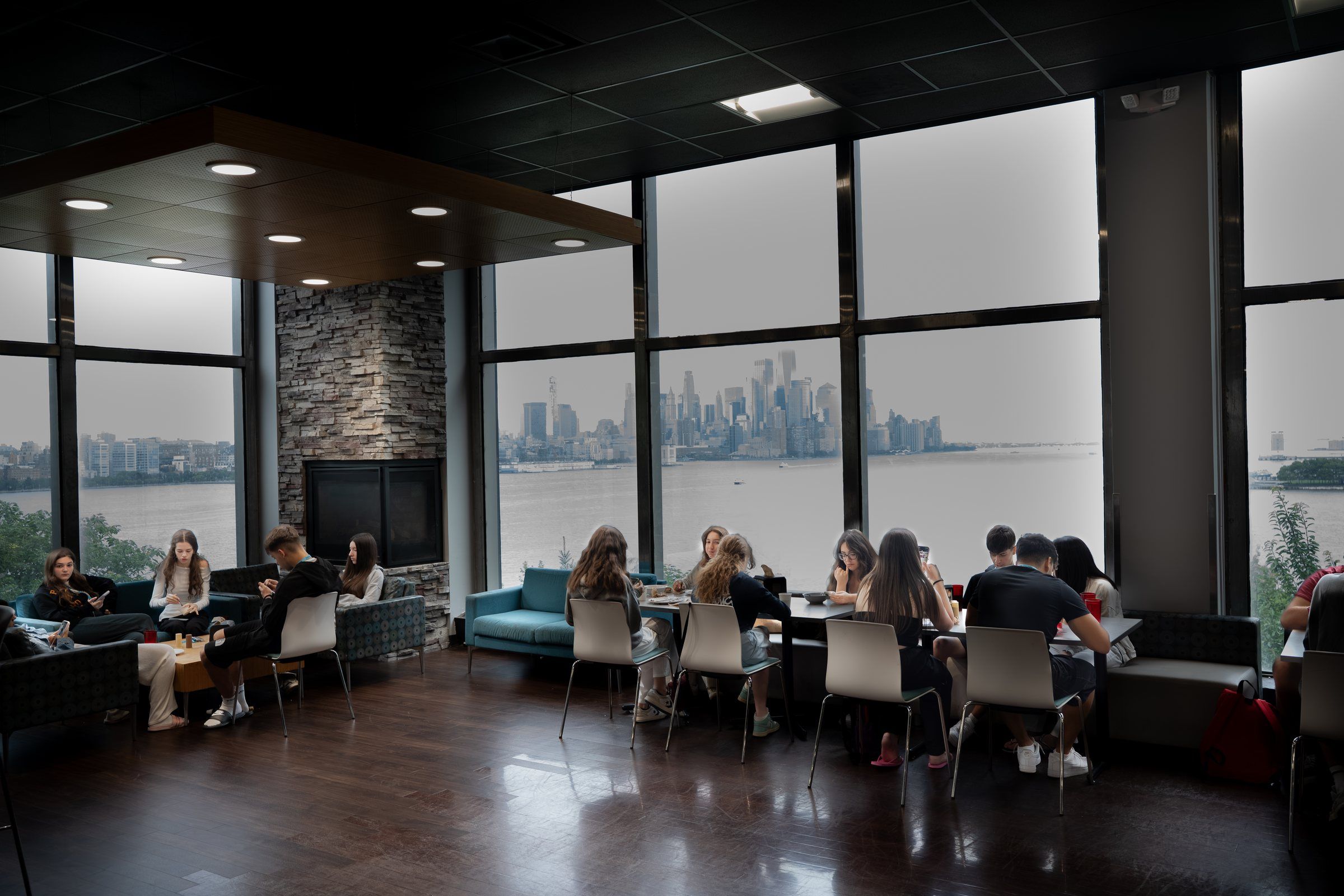 Stevens dining hall with the Manhattan skyline through the windows