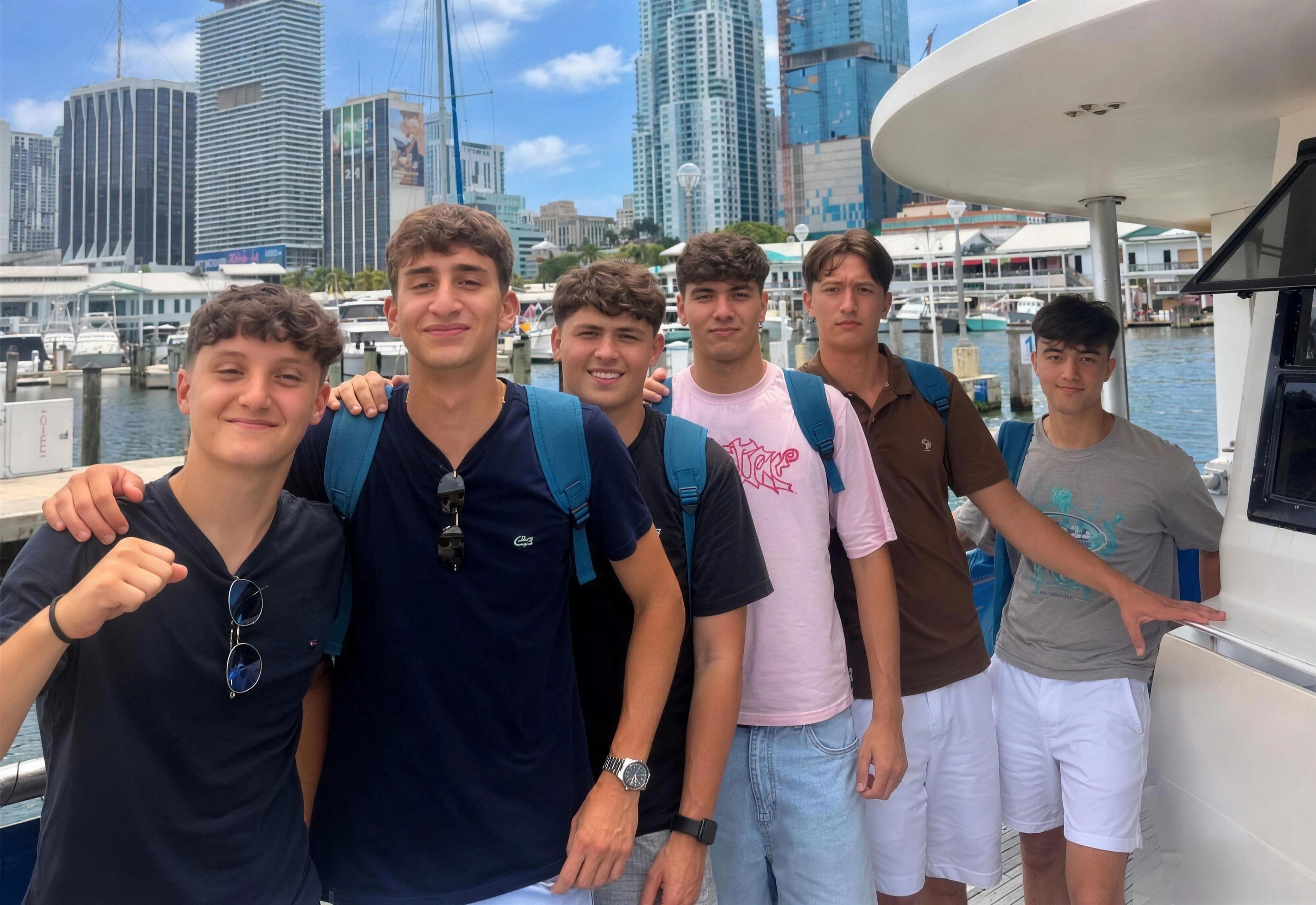 YES USA students smiling on a boat tour with the Miami skyline behind them