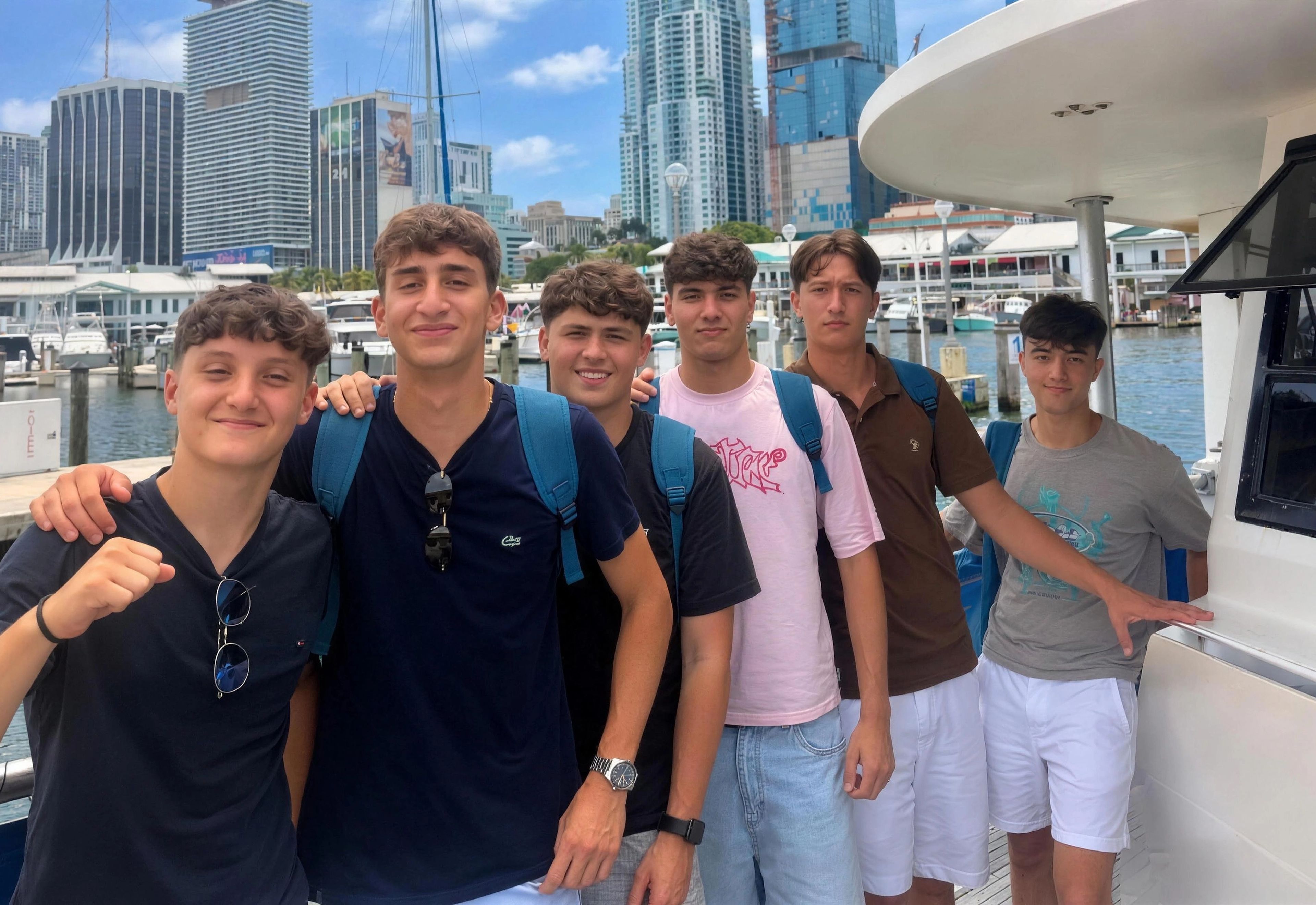YES USA students smiling on a boat tour with the Miami skyline behind them
