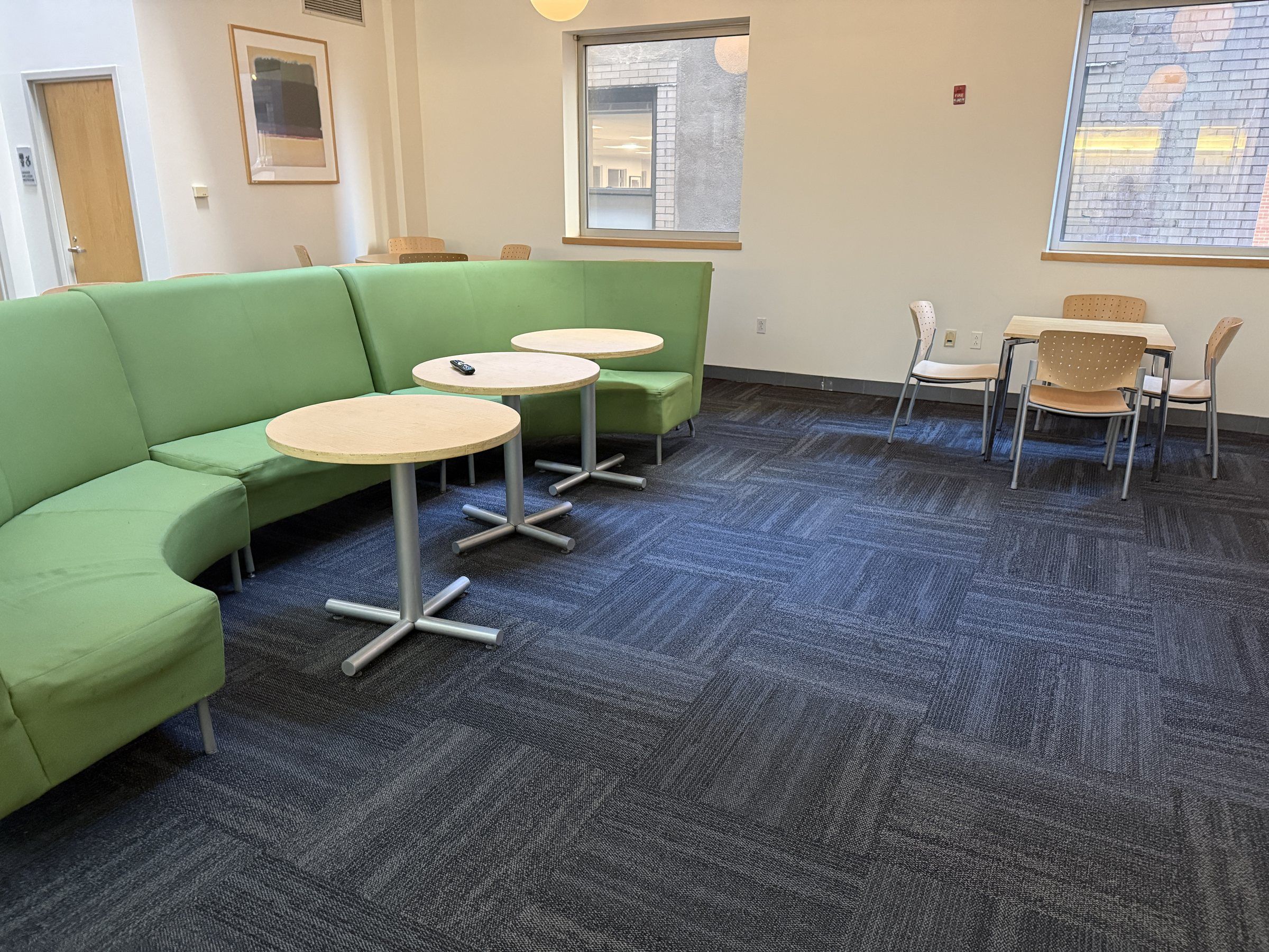 Residence lounge with green sofas and tables