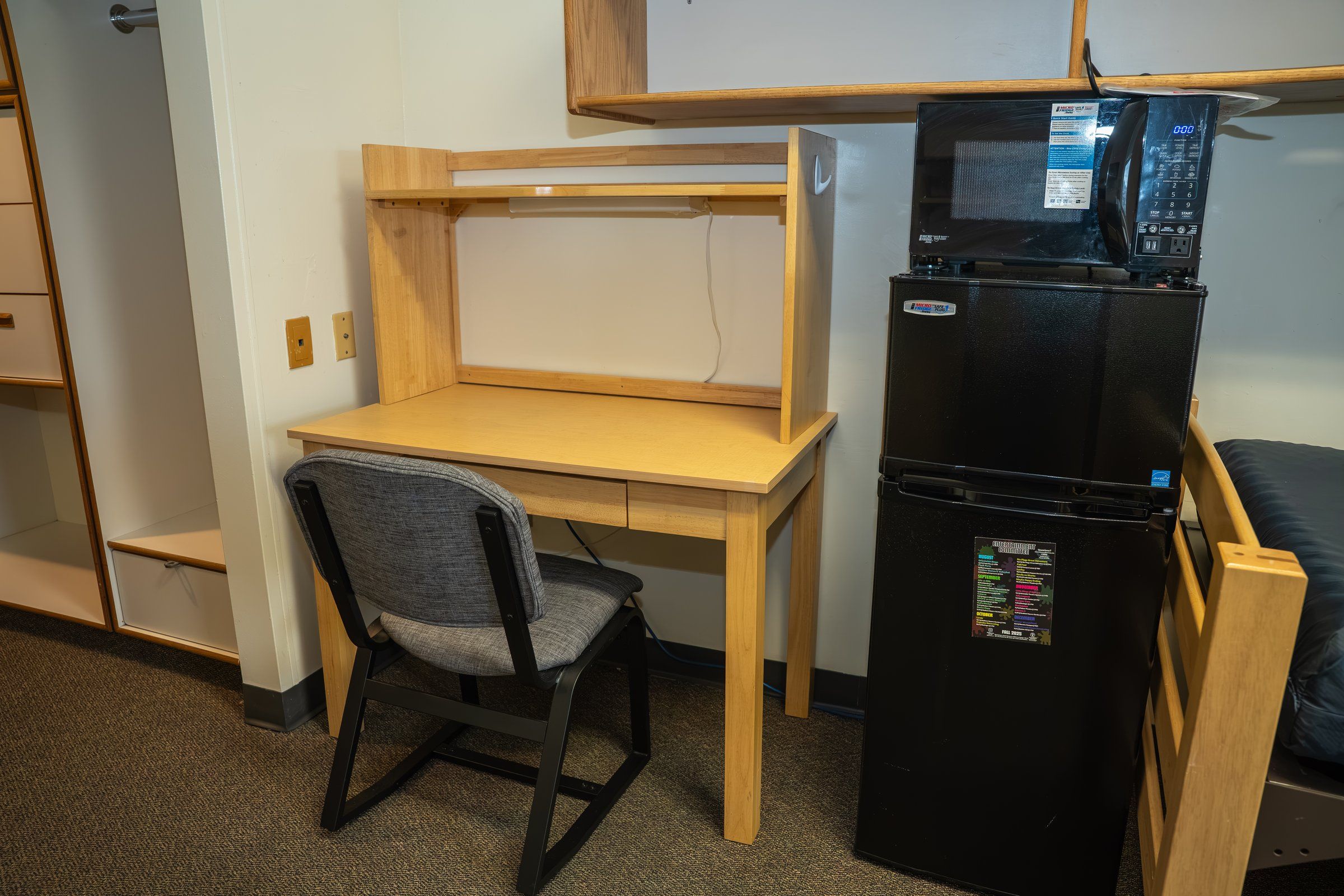 An example student residence room at Stevens, with a desk, a microwave and a fridge