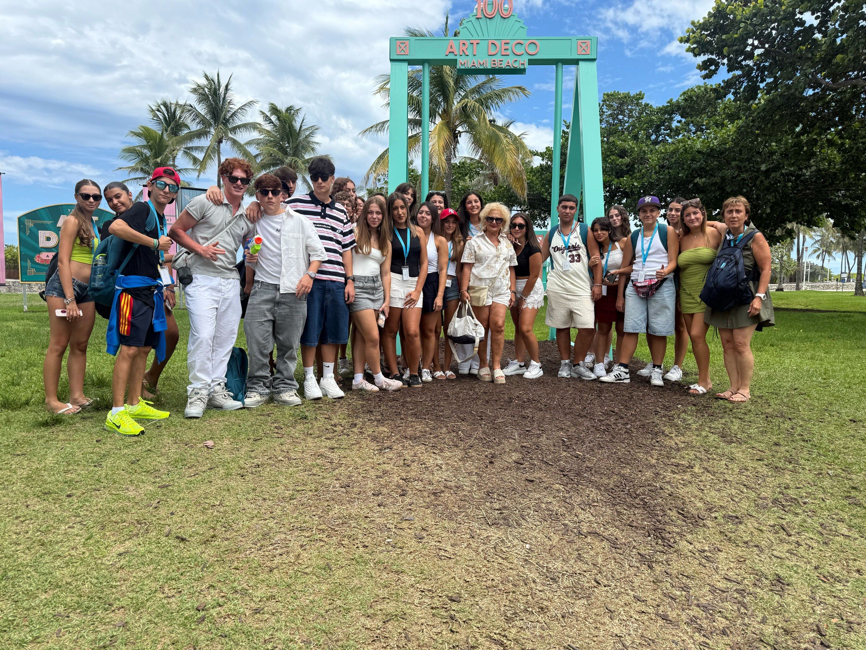 At the Art Deco sign in Miami Beach