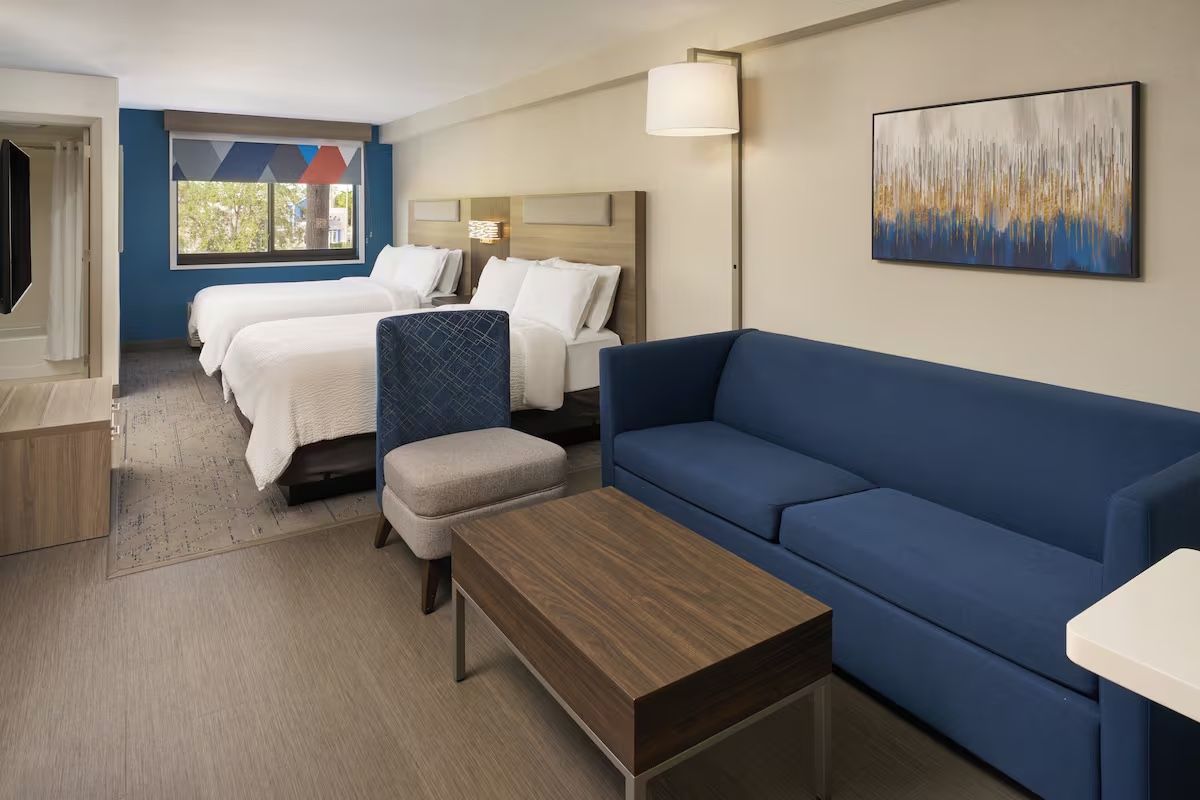 Example hotel room with two beds and a sofa