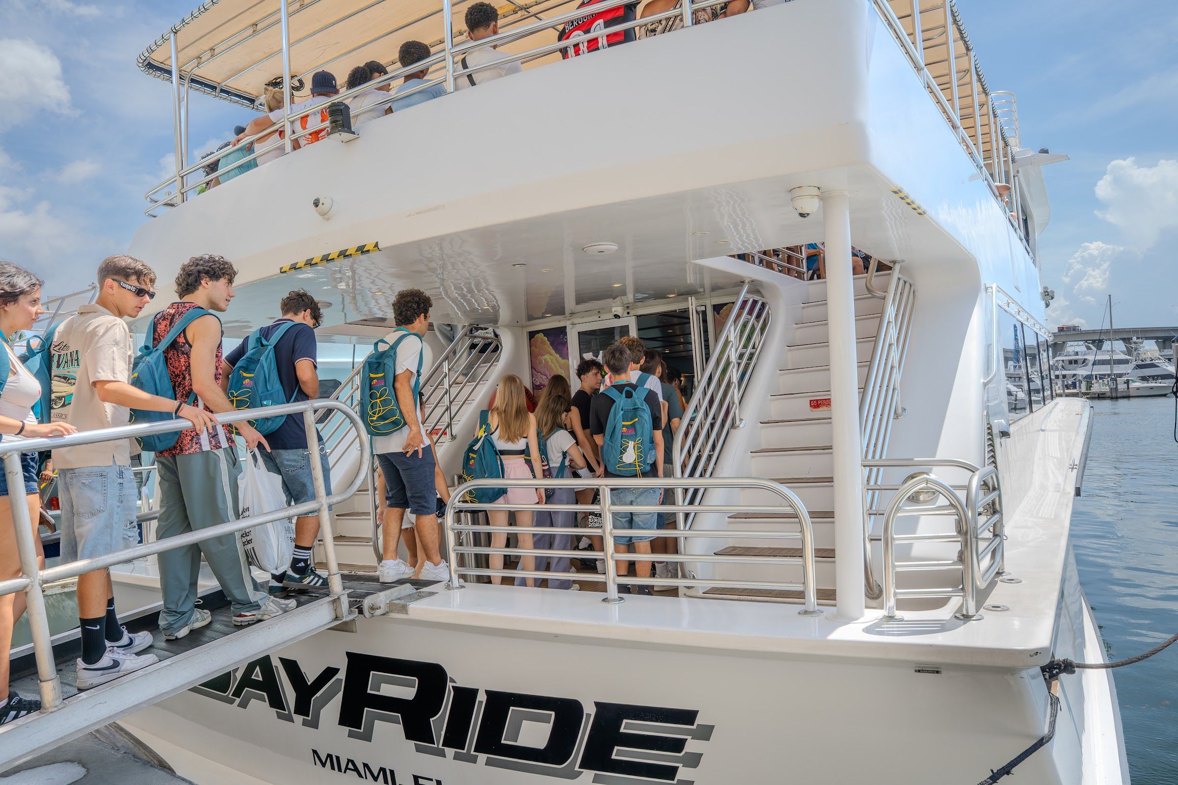 Students boarding a BayRide boat tour in Miami