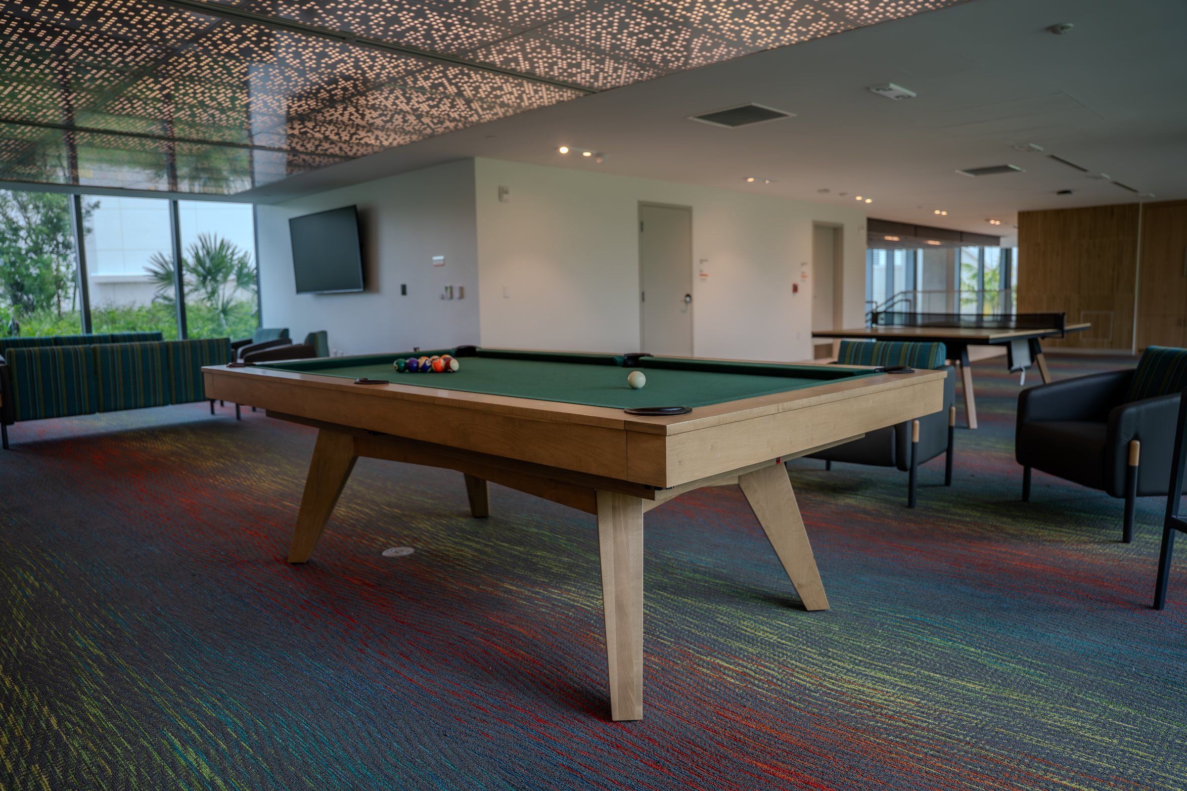 Residence games room with a pool table and table tennis