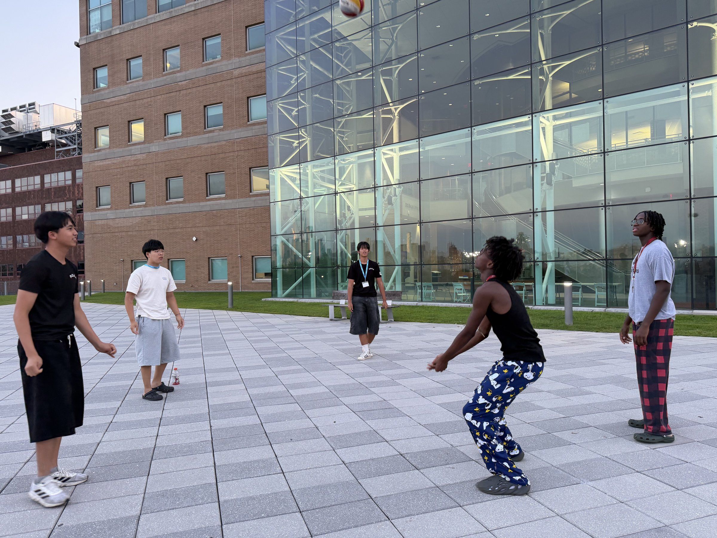 Students playing a ball game on the plaza outside the University Center at Stevens
