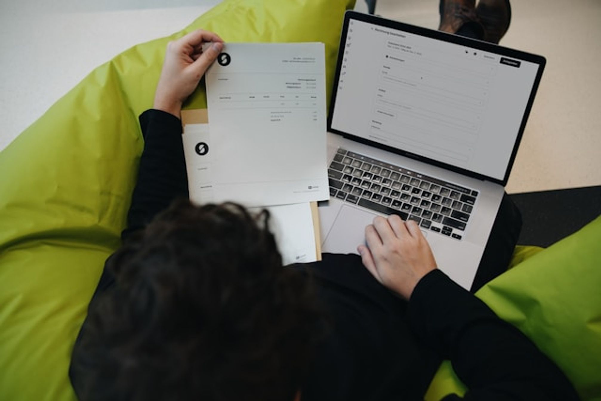 person holding invoice