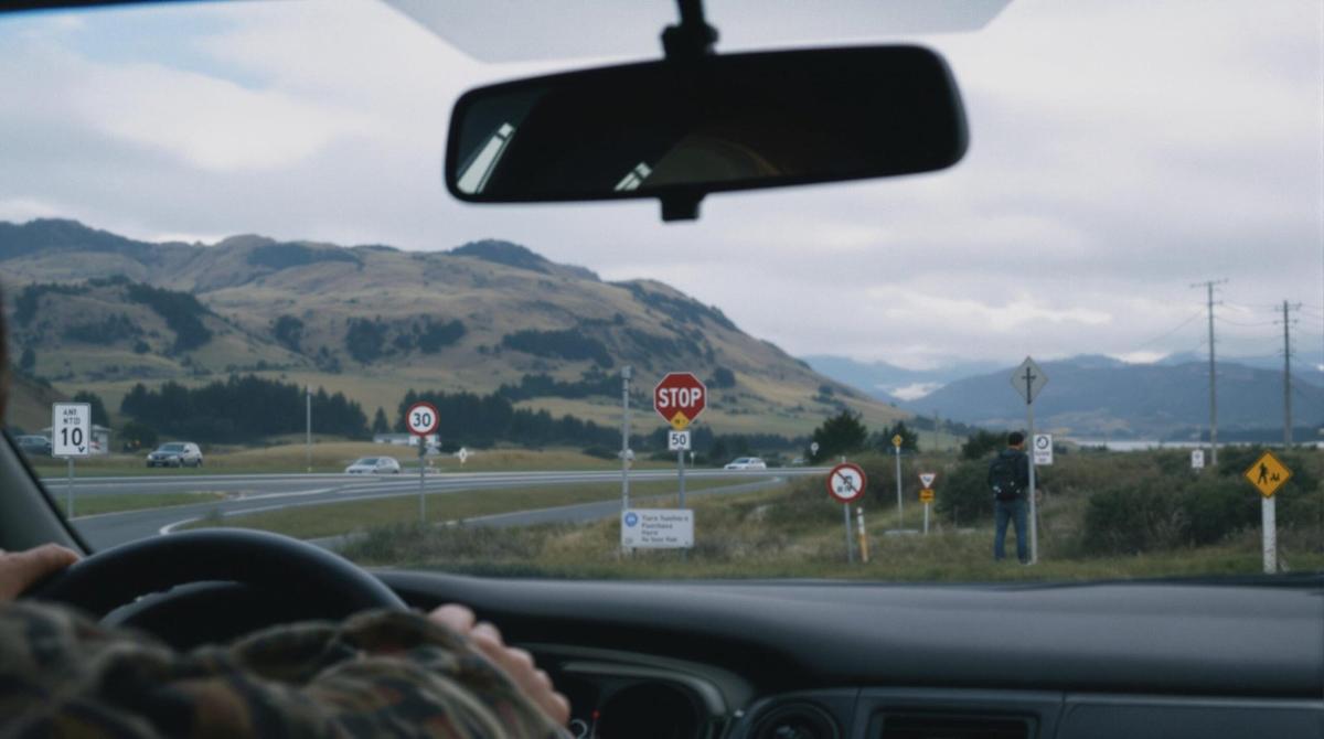 Japanese person driving on the left-side roads of New Zealand