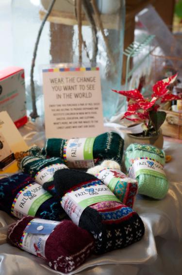 Colourful woollen socks from a sustainable range displayed in a shop 